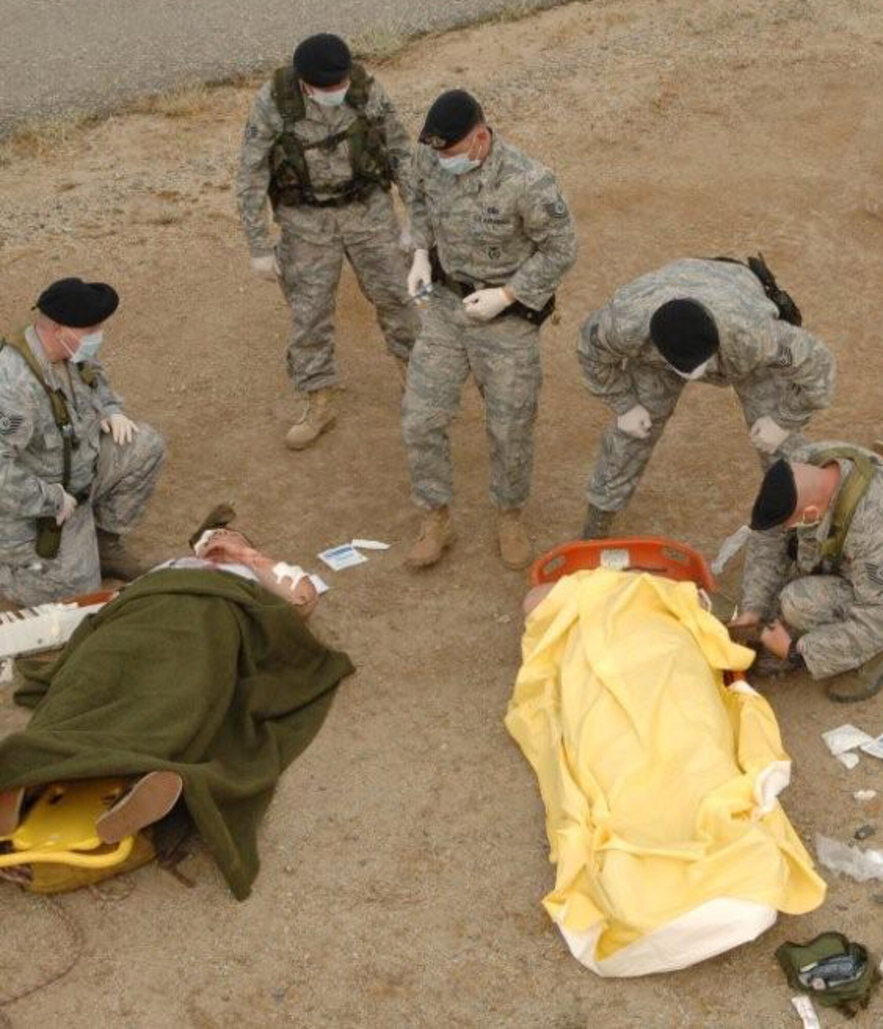 Base responders attend to simulated casualties who suffered various injuries. (U.S. Air Force photo by SSgt Stephen Schester).