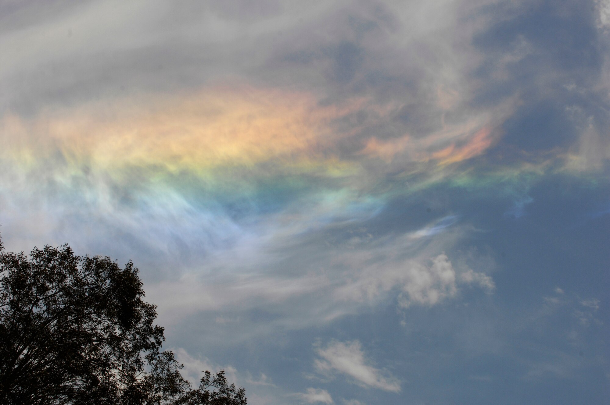 VANDENBERG AIR FORCE BASE, Calif. -- Team V received a glimpse of a rare optical phenomenon here May 18. The circumhorizontal arc, more popularly known as a "fire rainbow," appeared in the skies above Vandenberg approximately 11 a.m. to 1 p.m. The arc is formed when sunlight rays interact with the ice crystals of cirrus clouds, producing well-separated rainbow-like colors. If the crystal alignment is just right, this interaction makes the entire cirrus cloud appear to shine like a fiery rainbow. (U.S. Air Force photo/Senior Airman Matthew Plew)