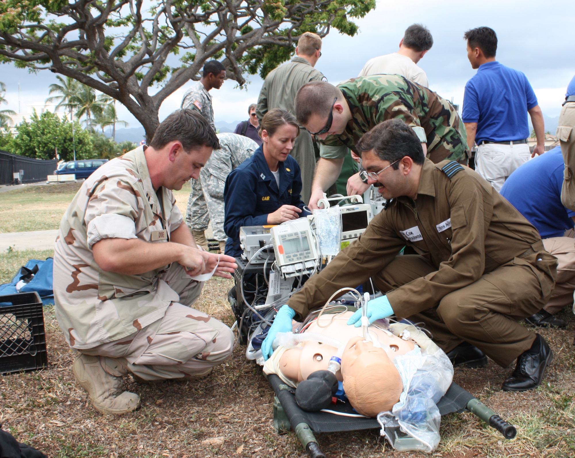 Navy Lt. Thomas Doke (left), a critical care nurse with the U.S. Naval Hospital Guam, and Wing Commander Ajay Handa, a pulmonologist from the Indian Air Force, train during the Joint Medical Attendant Transport Team training course held at Hickam Air Force Base, Hawaii May 11-15. The JMATT course, hosted by Thirteenth Air Force's Theater Patient Movement Requirements Center-Pacific, the aeromedical evacuation regulating organization for U.S. Pacific Command, focused on the aeromedical evacuation of critical care patients and equipment proficiency skills. (U.S. Air Force Photo/ Tech. Sgt. Kerry Jackson) 



