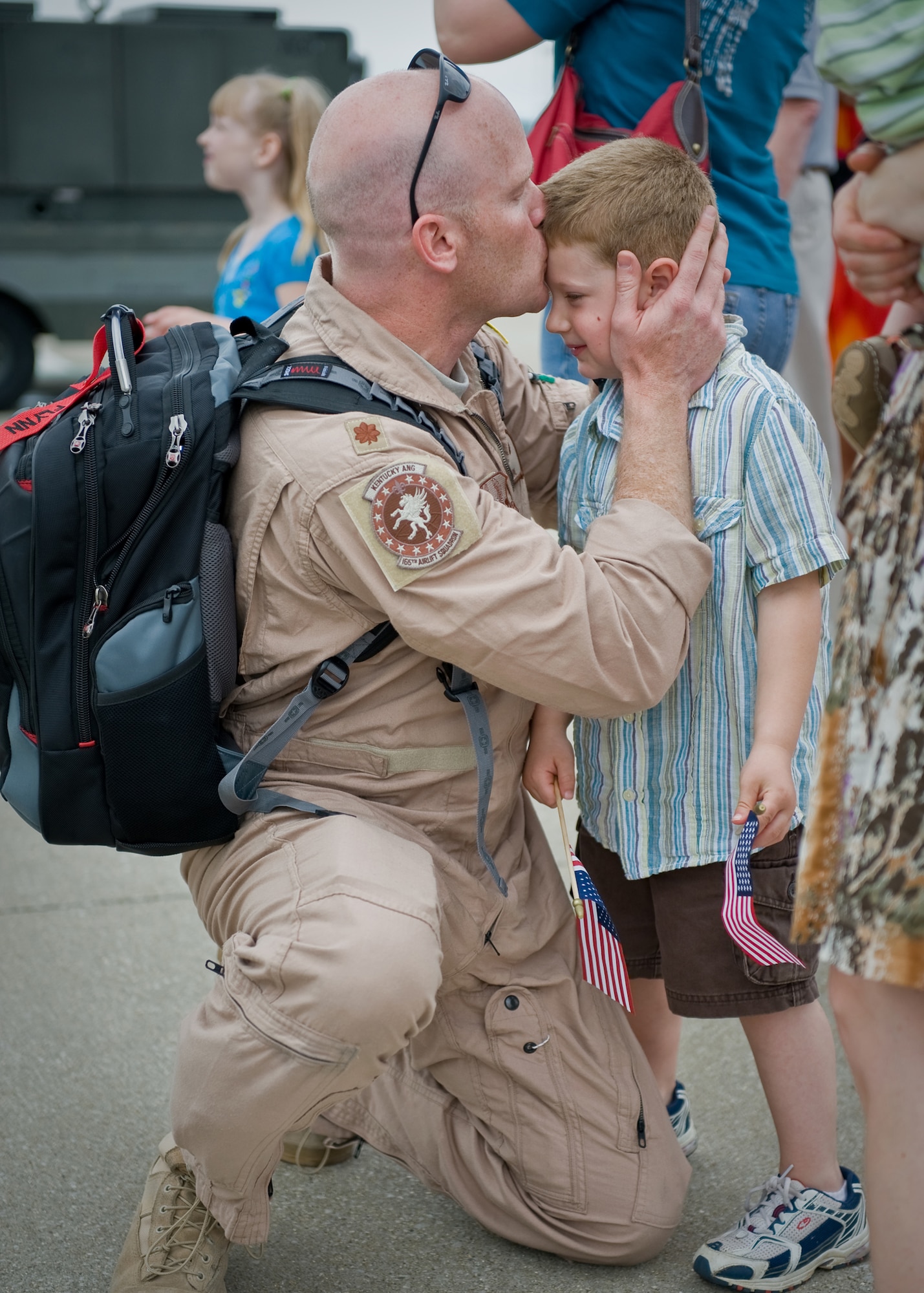 Maj. Dave Flynn, an aircraft commander in the 123rd Airlift Wing, greets his son on the flightline of the Kentucky Air National Guard Base in Louisville, Ky., on May 16, 2009. Major Flynn was returning from a two-month deployment to Afghanistan for Operation Enduring Freedom. (USAF photo by Capt. Dale Greer.)