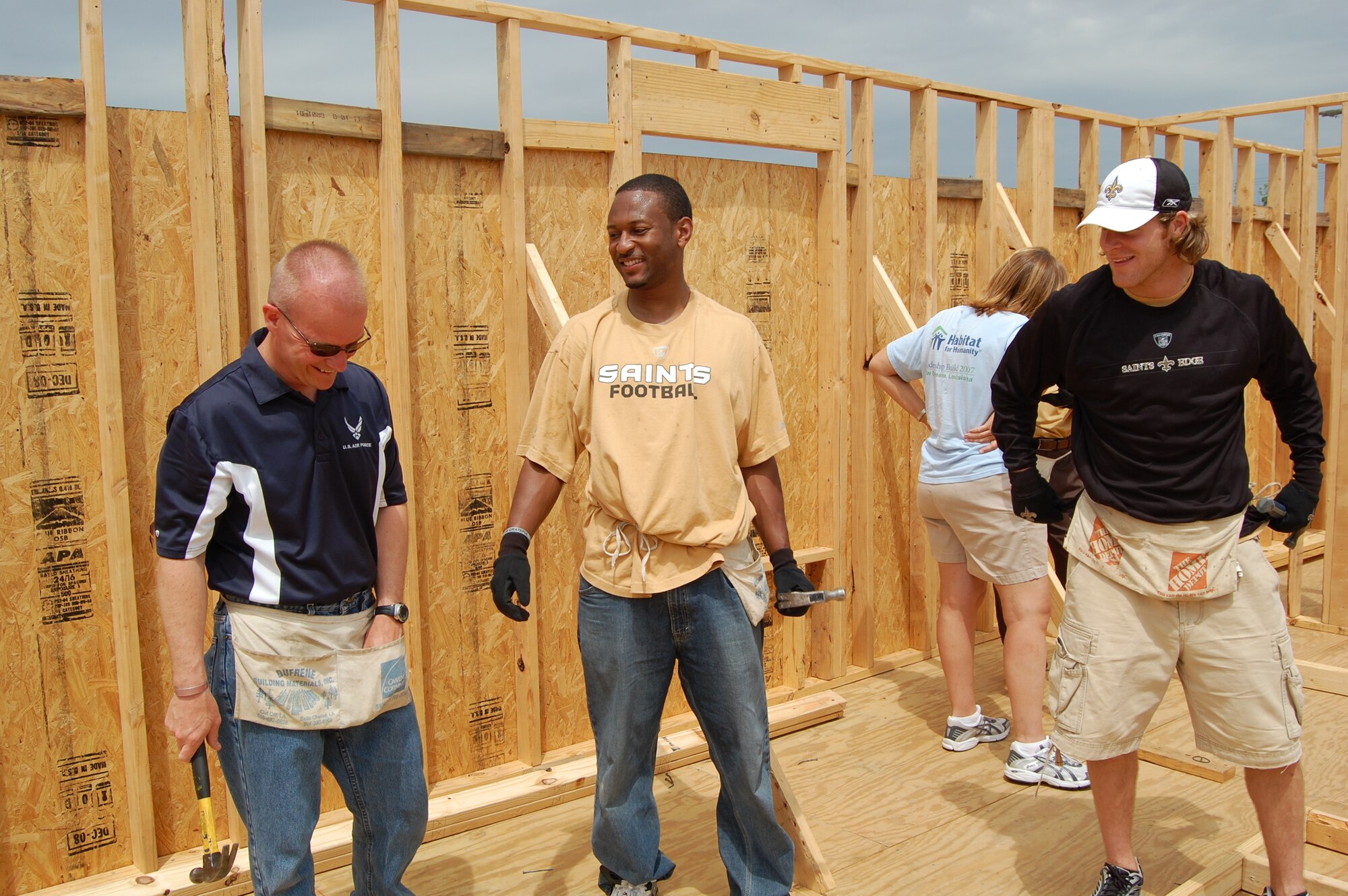 Members of the New Orleans Saints football team and recruiters from the 331st Recruiting Squadron construct a Habitat for Humanity house in Musicians’ Village located in New Orleans Lower 9th Ward. (Courtesy photo)