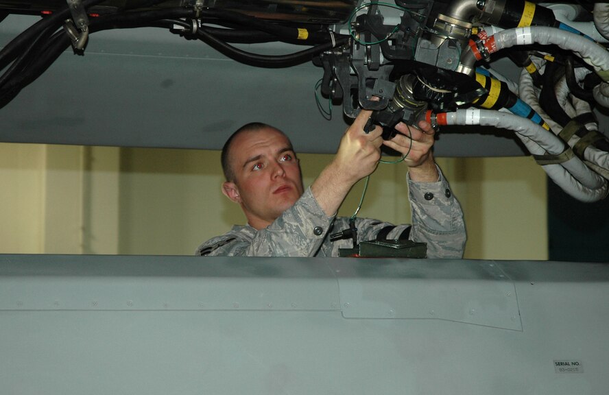 MINOT AIR FORCE BASE, N.D. – Airman 1st Class Ryan Stiles, 5th Munitions Squadron, prepares to load an Air Launch Cruise Missile at the Weapons Storage Area, during a Nuclear Surety Inspection here, May 16. An NSI is designed to evaluate a unit's readiness to execute nuclear operations. Areas to be evaluated during the NSI include operations, maintenance, security, and support activities needed to ensure the wing performs its mission in a safe, secure and reliable manner. This no-notice inspection is expected to conclude May 22. (U.S. Air Force photo by Senior Airman Wesley Wright)