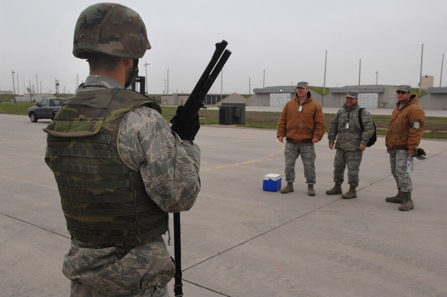 MINOT AIR FORCE BASE, N.D. – Senior Airman Donald Derusha, 5th Munitions Squadron, stands guard at the Weapons Storage Area during a Nuclear Surety Inspection here, May 15. An NSI is designed to evaluate a unit's readiness to execute nuclear operations. Areas to be evaluated during the NSI include operations, maintenance, security, and support activities needed to ensure the wing performs its mission in a safe, secure and reliable manner. This no-notice inspection is expected to conclude May 22. (U.S. Air Force photo by Staff Sgt. Stacy Moless)