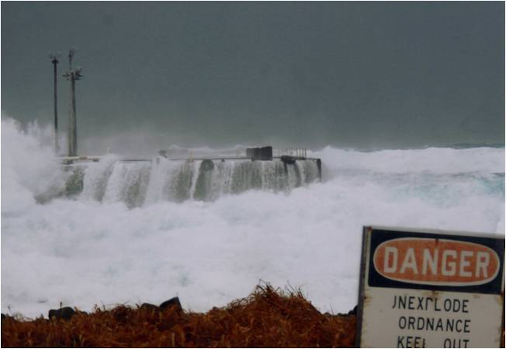 The dock at Eareckson Air Station, Shemya Island, during a storm on the Bering Sea. Eareckson's dock is the main off-load point for fuel and supply barges. (U.S. Air Force photo)