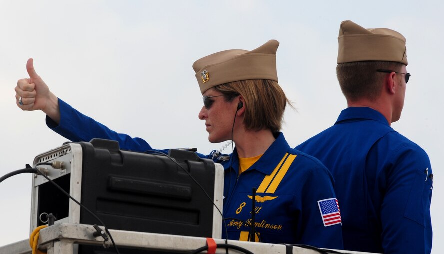 U.S. Navy Lt. Amy Tomlinson, events coordinator for the Navy Flight Demonstration Squadron Blue Angels, gives the thumbs up to the Blue Angels' flight commander to signal it is safe to take-off during the first day of the 2009 Defenders of Liberty Air Show held here May 9. The air show also features the Canadian Forces Snowbirds and Air Combat Command F-15E Strike Eagle Demonstration Team. (U.S. Air Force photo by Senior Airman Joanna M. Kresge)