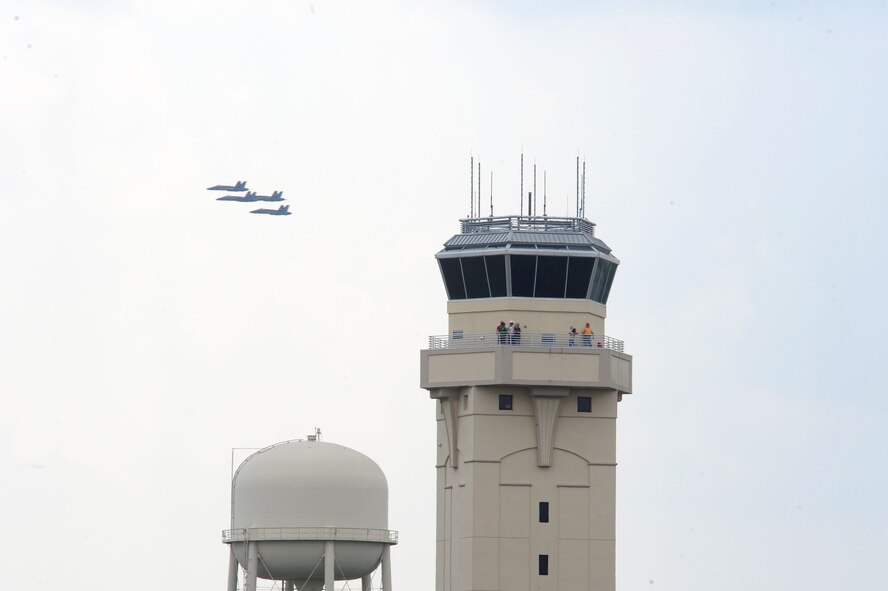 The Navy Flight Demonstration Squadron, Blue Angels, fly past the control tower here during the first day of the 2009 Defenders of Liberty Air Show May 9. The air show also features the Canadian Forces Snowbirds and Air Combat Command F-15E Strike Eagle Demonstration Team. (U.S. Air Force photo by Senior Airman Joanna M. Kresge)
