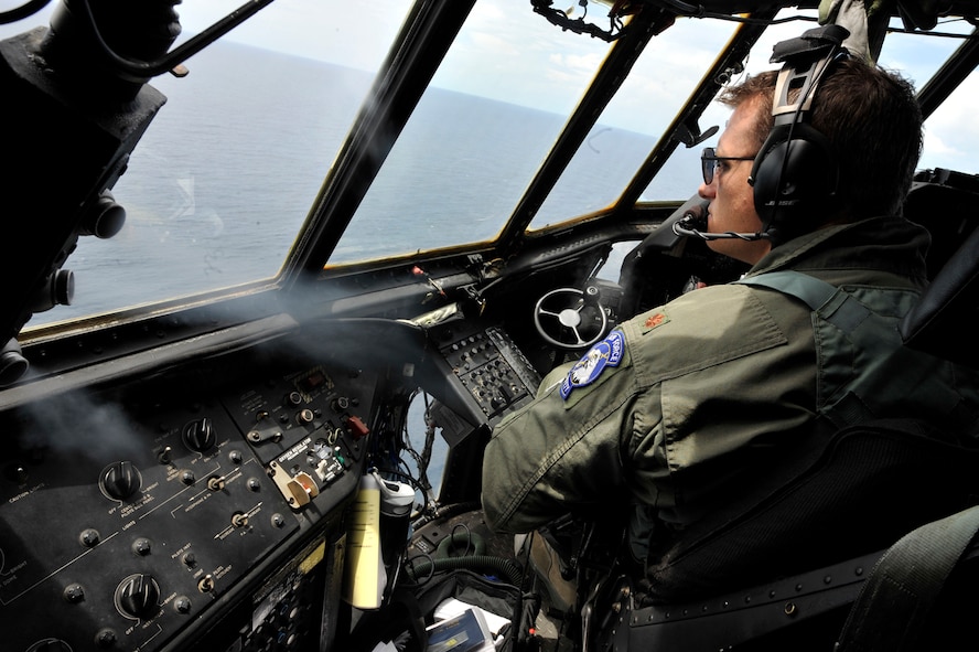 MOODY AIR FORCE BASE, Ga. -- Maj. Jim Brunner, 71st Rescue Squadron HC-130P/N Combat King pilot, along with aircraft crewmembers assist the U.S. Coast Guard in a search and rescue mission over the Atlantic Ocean May 15. An area covering approximately 770 miles was searched by the Moody based crew in an effort to recover survivors from a capsized boat that was carrying Haitian immigrants. (U.S. Air Force photo by Senior Airman Schelli Jones)