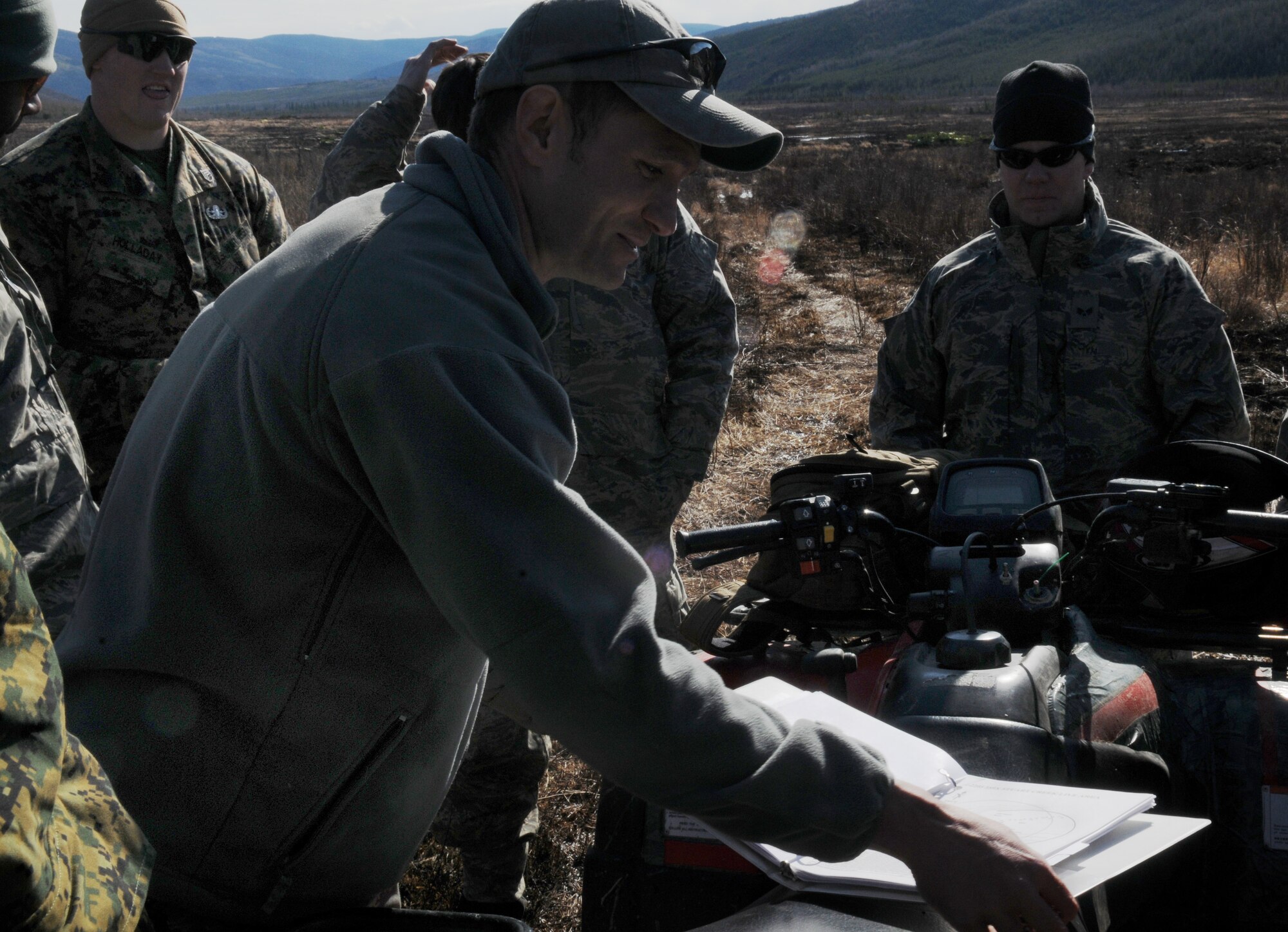 Senior Master Sgt.  Albert Schneider gives a quick brief May 14, 2009, Pacific Alaskan Range Complex. The Airmen and Marines are clearing the range of live munitions after several Red Flag operations. Sergeant Schneider is with the 354th Civil Engineering Squadron Explosive Ordnance Flight. (U.S. Air Force photo/Airman 1st Class Laura Max)