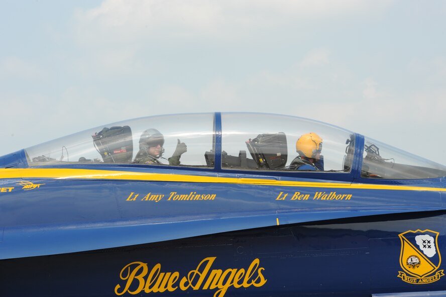 U.S. Air Force Lt. Gen. Robert J. Elder Jr., 8th Air Force commander, gives a thumbs up as U.S. Navy Lt. Ben Walborn, Navy Flight Demonstration Squadron and Blue Angels jet 7 pilot, taxi down the runway. The Blue Angels are one of the headliners for the 2009 Defenders of Liberty Air Show here.  (United States Air Force photo by Senior Airman Alexandra Sandoval) (RELEASED)
