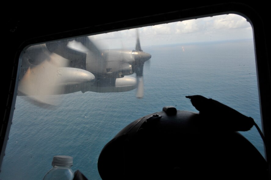 MOODY AIR FORCE BASE, Ga. -- A 71st Rescue Squadron HC-130P/N Combat King aircraft participates in a search and rescue mission over the Atlantic Ocean as crew members search for Haitian immigrants who have been missing at sea May 15. (U.S. Air Force photo by Senior Airman Schelli Jones)
