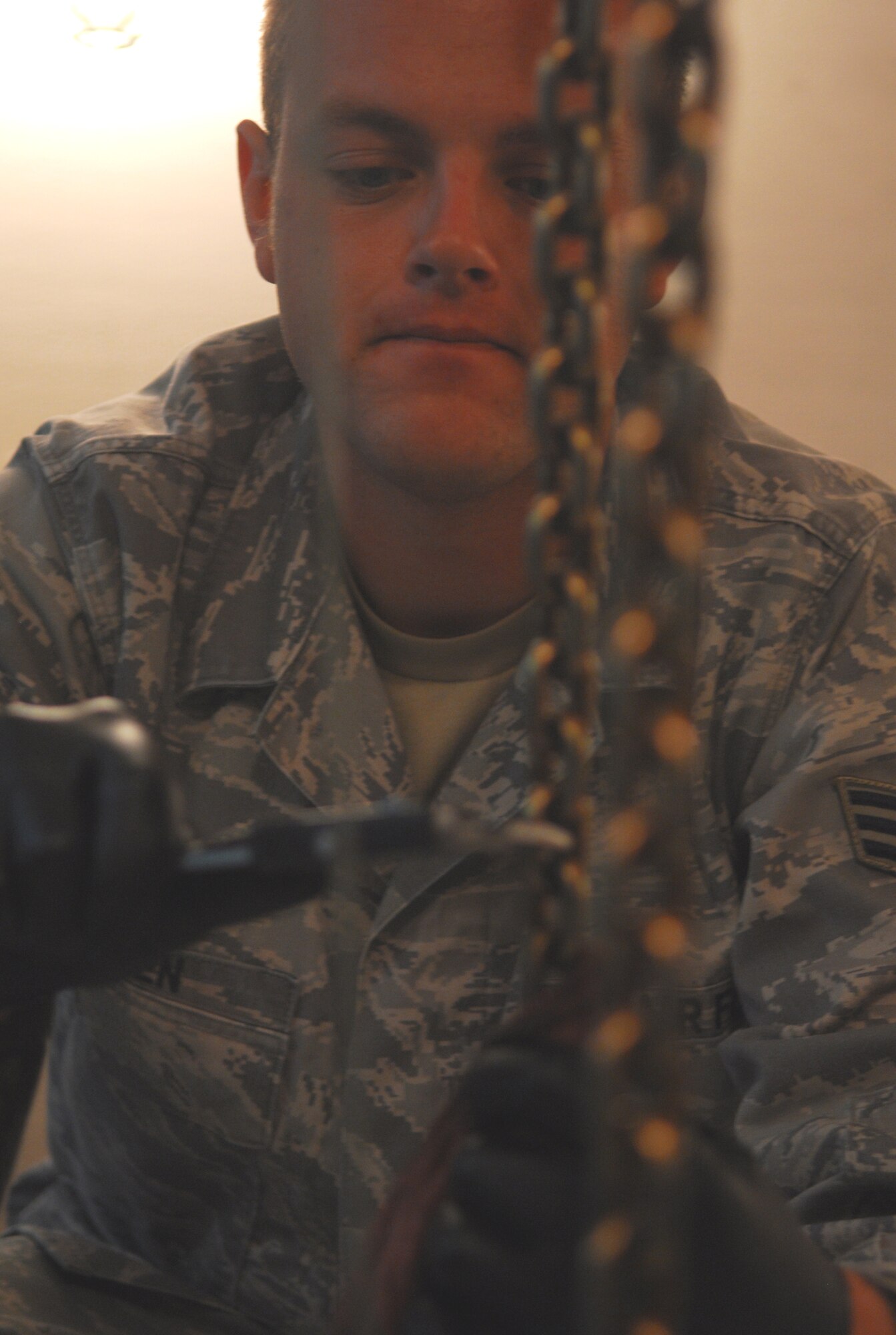 VANDENBERG AIR FORCE BASE, Calif. -- During an annual inspection, Senior Airman Colby Green of the 576th Flight Test Squadron executes a hoist chain inspection on a payload transporter here May 14. (U.S. Air Force photo/Senior Airman Christopher Hubenthal)