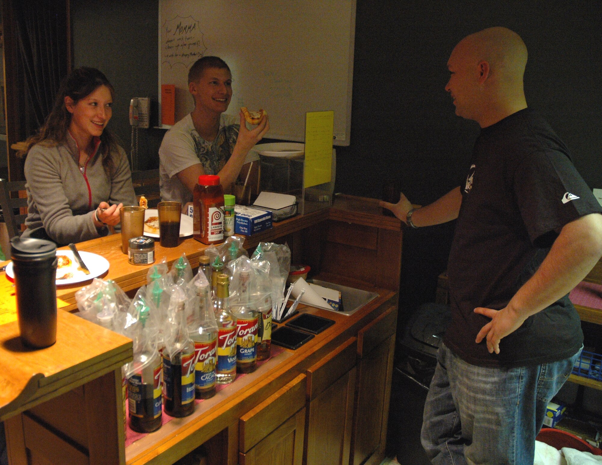 Airman 1st Class Dannielle Goulet, 341st Security Forces Squadron member, Airman 1st Class Johnathan Hudock, 341st Missile Maintenance Squadron facility maintenance team member and 2nd Lt. Jared Hostetler, 341st MMXS officer in charge of missile maintenance training, share stories while volunteering for the Airmen Against Drunk Driving program May 9 at the Detour. (U.S. Air Force photo/Senior Airman Dillon White) 