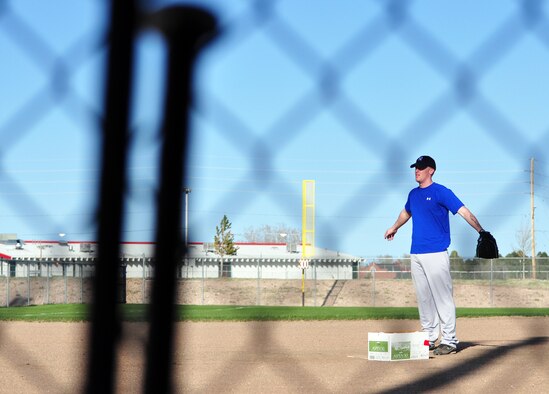 Airmen McMillen, stretches prior to pitching for the Warren’s softball home run derby.