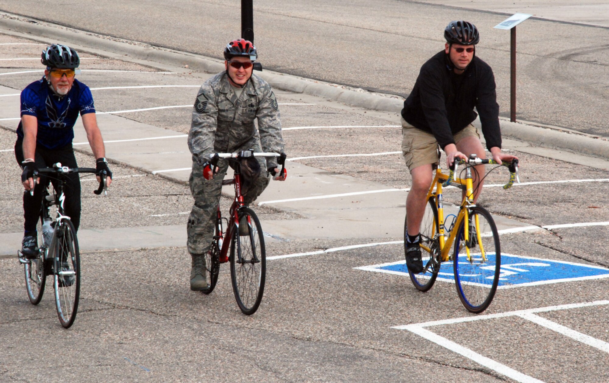 Bob Kodis, Master Sgt. Stanley Joslin and Tech. Sgt. Randy Ridenour, all from 90th Missile Wing Plans and Programs office, ride their bikes to work May 11 in support of bike-to-work week, a nationwide campaign to get people out of their cars and onto their bikes (U.S. Air Force Photo/Staff Sgt. Chad Thompson).