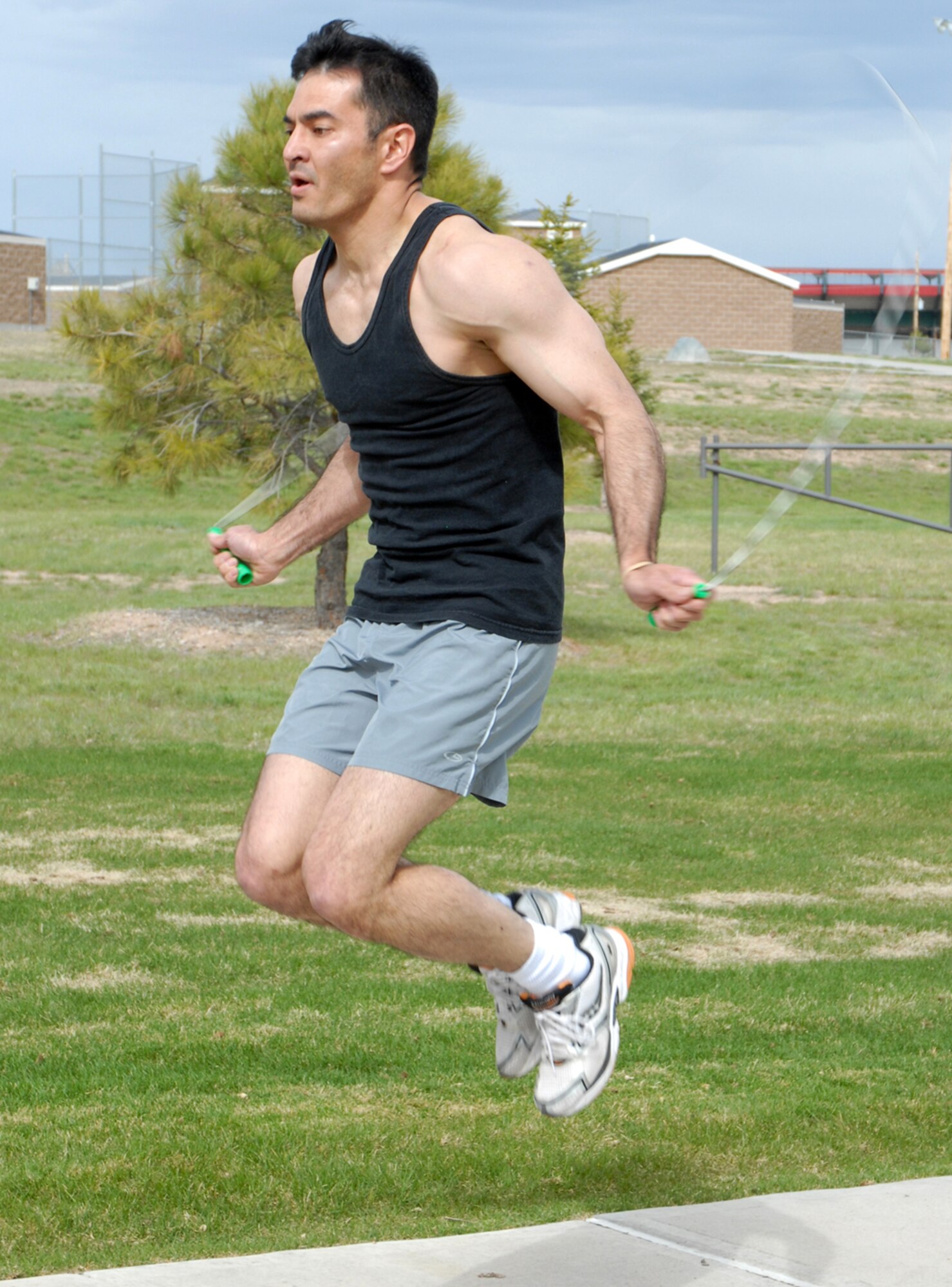 Tech. Sgt. Gordon Lewis, 90th Missile Security Forces Squadron, high steps in the double-under jump rope completion May 6 during the first heat of Warren’s Fittest challenge at the Freedom Hall Fitness Center. Sergeant Lewis won the event for the men and Senior Airman Sandi Tran, 153rd Force Support Squadron, won the woman’s title of Warren’s Fittest (U.S. Air Force Photos/Berni Ernst).