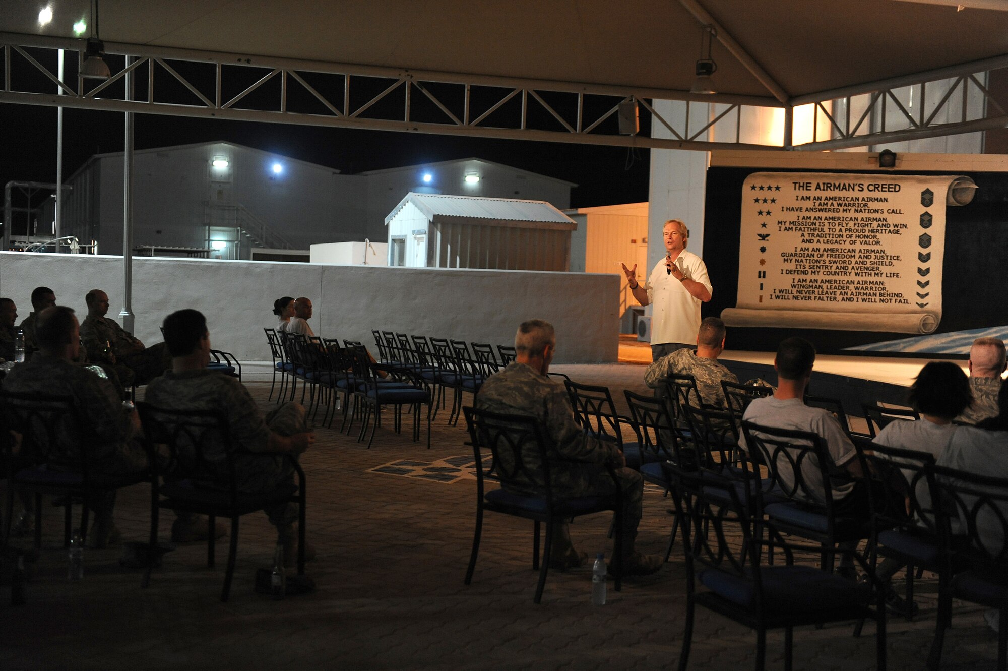 SOUTHWEST ASIA - Mr. Dan Clark, inspirational speaker and author, speaks to Airmen from the 380th Air Expeditionary Wing, May 11 at an undisclosed location in Southwest Asia. During Mr. Clark's speech, he tried to encourage Airmen to do their best and work hard in all aspects of life and take the hard work done here home with them. (U.S. Air Force photo by Senior Airman Brian J. Ellis) (Released)