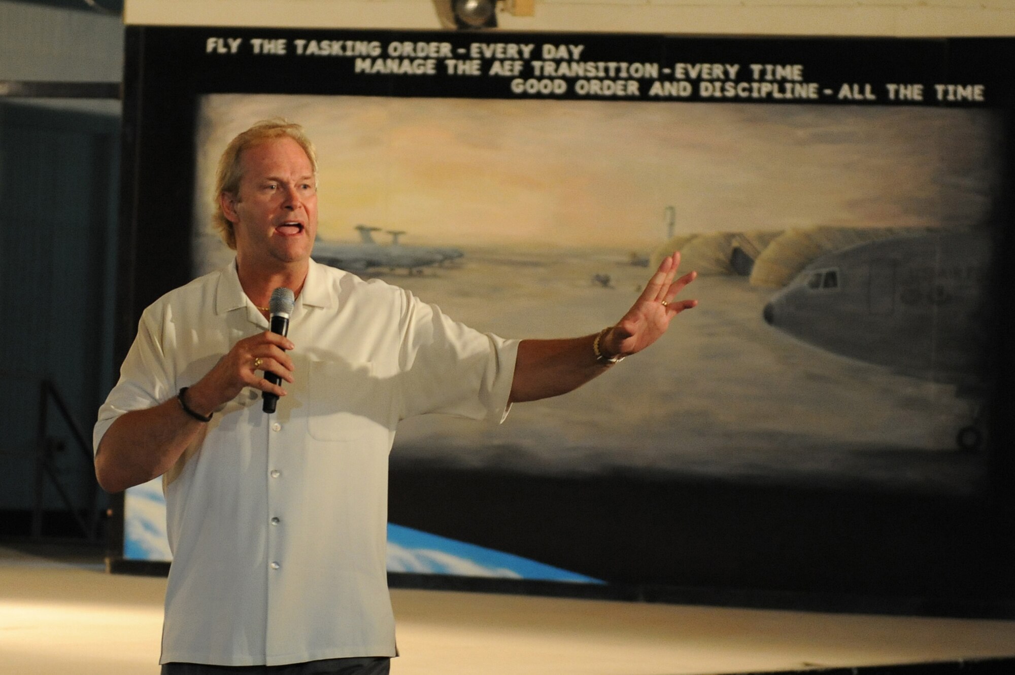 SOUTHWEST ASIA - Mr. Dan Clark, inspirational speaker and author, speaks to Airmen from the 380th Air Expeditionary Wing, May 11 at an undisclosed location in Southwest Asia. During Mr. Clark's speech, he tried to encourage Airmen to do their best and work hard in all aspects of life and take the hard work done here home with them. (U.S. Air Force photo by Senior Airman Brian J. Ellis) (Released)