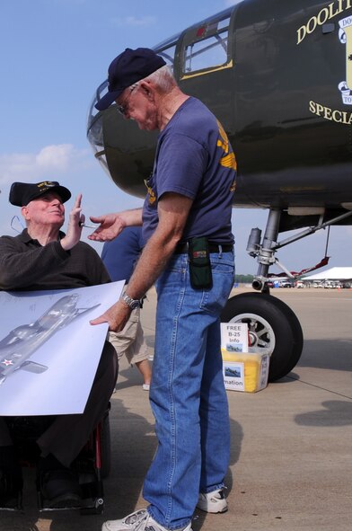 Boyd Jenkins, disabled veteran, signs a commemorative lithograph. It will be donated to the 8th Air Force Museum by the Disabled American Veterans. The DAV sponsored the display of the B-25 Special Delivery Bomber during the 2009 Defenders of Liberty Air Show here May 9 and 10.(U.S. Air Force photo by Senior Airman La'Shanette Garrett)(released).
