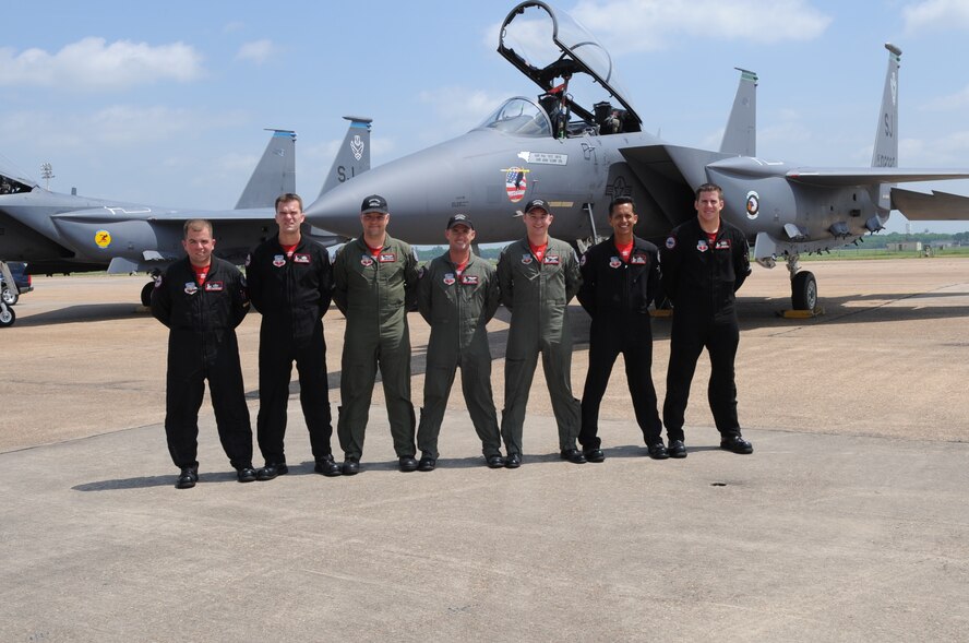 Pilots and crew chiefs of the Strike Eagle Demo Team pose for a photo with their F-15 May 8. The 2009 Defenders of Liberty Air Show runs from May 9 and 10. (United States Air Force photo by Senior Airman Alexandra Sandoval) (RELEASED)