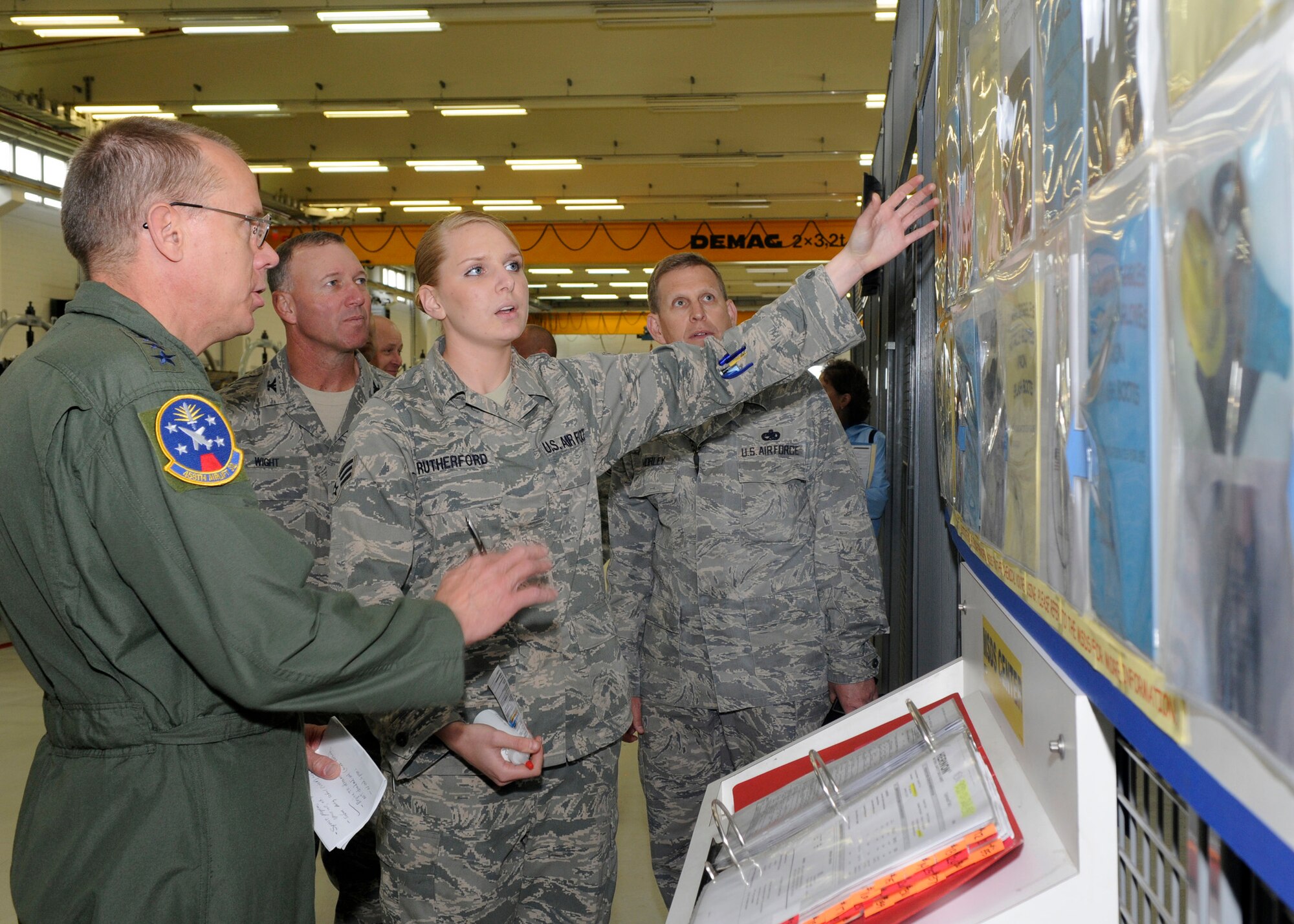 SPANGDAHLEM AIR BASE, Germany -- Senior Airman Erin Rutherford, 52nd Component Maintenance Squadron,  gives Gen. Donald Hoffman, Air Force Material Command commander, a tour of the 52nd CMS engine shop.  General Hoffman is a former commander of the 52nd Fighter Wing.  (U.S. Air Force photo by Airman 1st Class Staci Miller)
