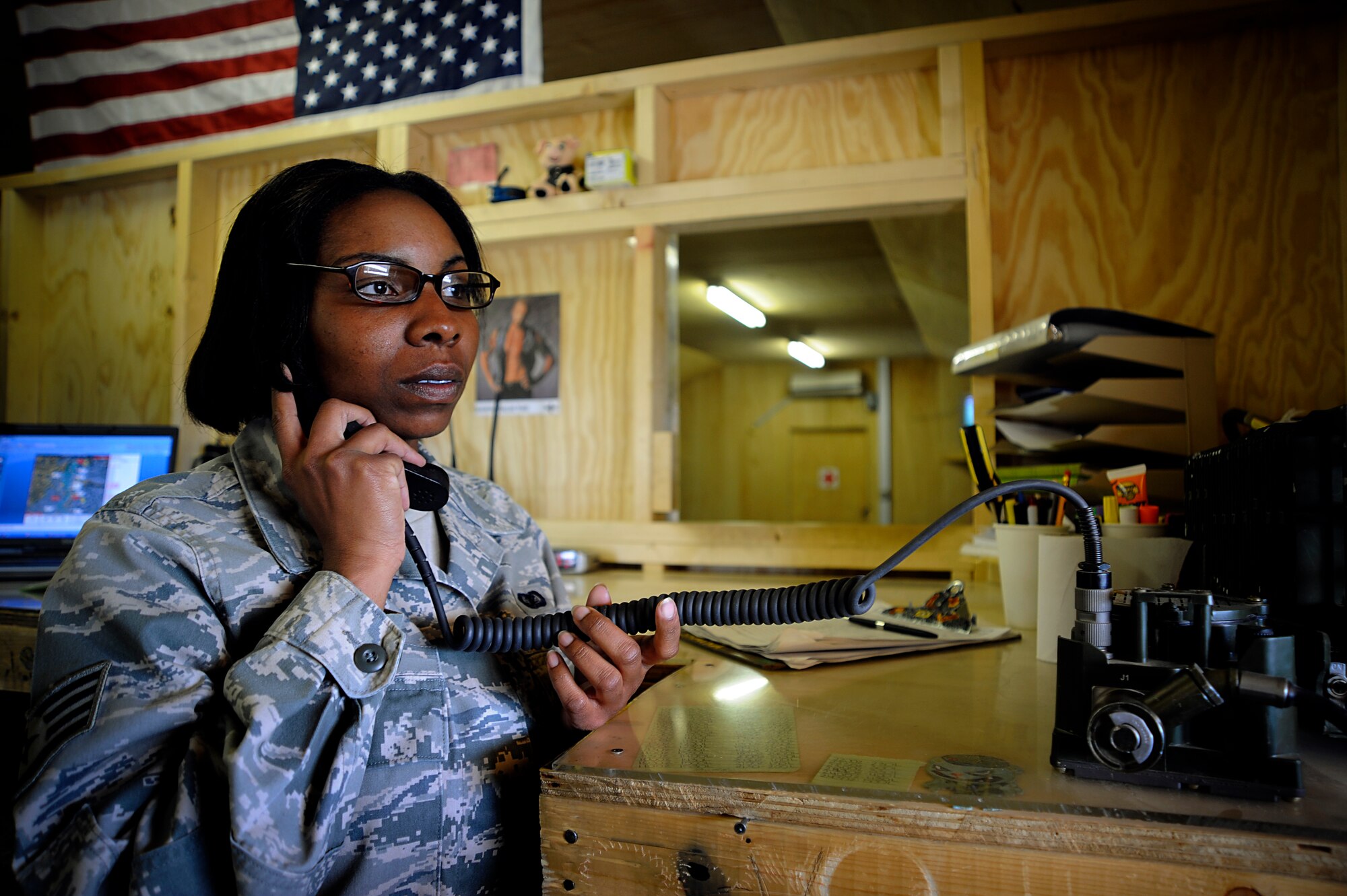 U.S. Air Force Staff Sgt. Benitra Colvin deployed to Afghanistan directs pilots of two UH-60 Black Hawks as they prepare to land at Forward Operating Base Gardez, Afghanistan, April 21, 2009. Due to manning shortfalls Sgt. Colvin who was originally assigned as a operations manager for the Paktya Provincial Reconstruction Team, has been requested to help with Air Traffic Control.  (U.S. Air Force photo by Staff Sgt. Shawn Weismiller)