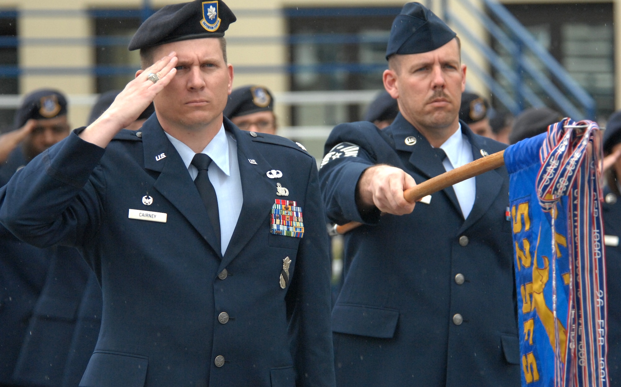 SPANGDAHLEM AIR BASE, GERMANY -- Lt. Col. Paul Cairney, 52nd Security Forces commander, and 52nd SFS First Sergeant Master Sgt. James Piper render arms during retreat May 15, 2009.  The 52nd SFS held a retreat ceremony in memory of law enforcement officials, both civilian and military, who lost their lives during the past year. (U.S. Air Force photo by Master Sgt. Bill Gomez) 