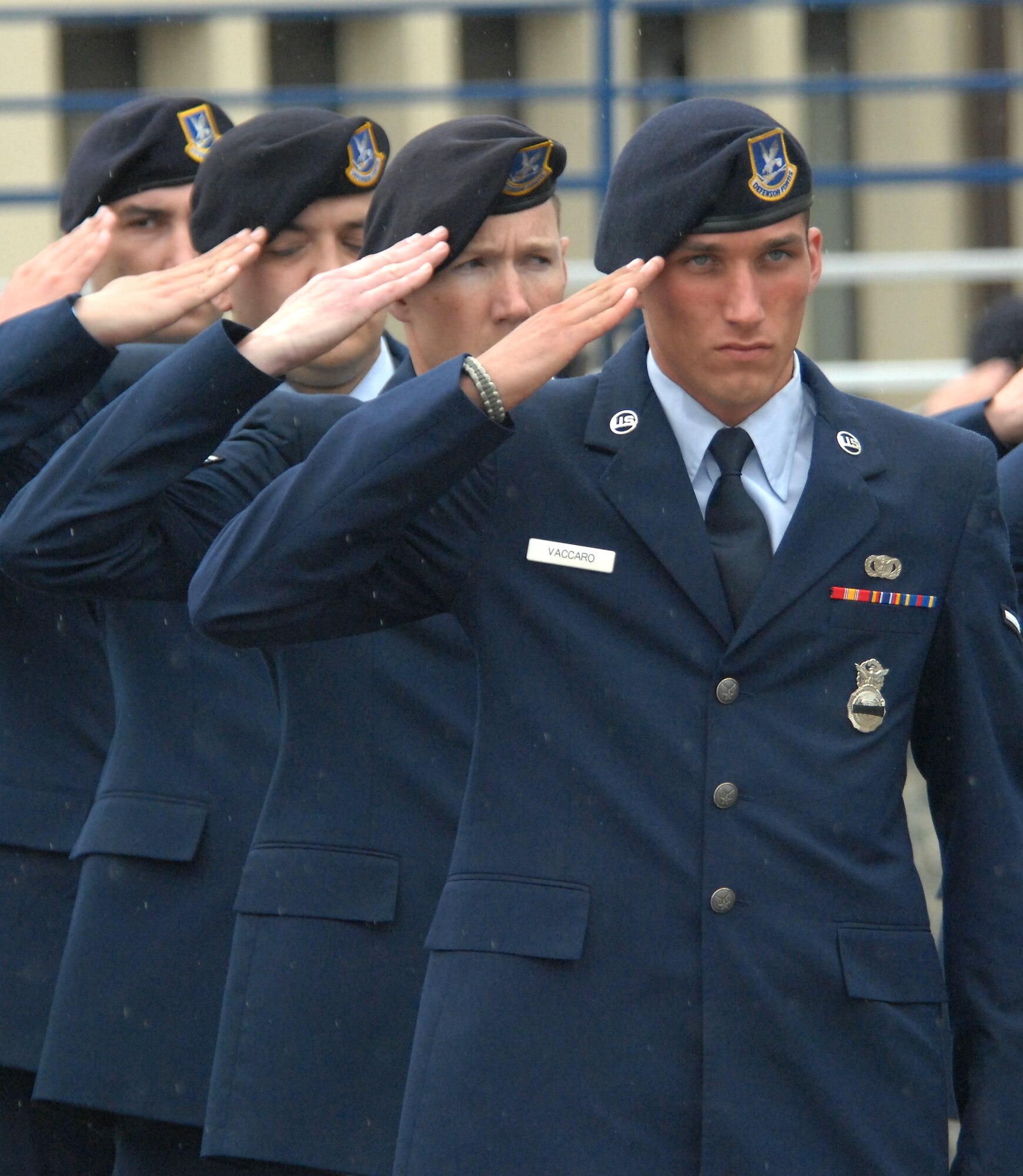 SPANGDAHLEM AIR BASE, GERMANY-- Airman Anthony Vaccaro, 52nd Security Forces squadron member, along with others from his unit, render a salute during retreat May 15, 2009.  The 52nd SFS held a retreat ceremony in memory of law enforcement officials, both civilian and military, who lost their lives during the past year. (U.S. Air Force photo by Master Sgt. Bill Gomez) 