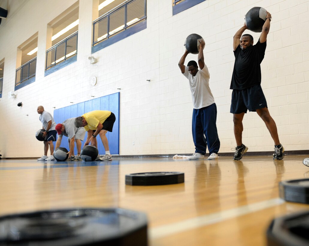 LANGLEY AIR FORCE BASE, Va. -- Staff Sgt. James Beck, 27th Fighter Squadron aviation resource manager, exercises alongside Staff Sgt. Balfour Walker, 1st Force Support Squadron fitness specialist, during a Velocity class here May 15.  Certified representatives from Velocity led a physical conditioning class geared toward improving overall physical performance.  (U.S. Air Force photo/Senior Airman Vernon Young)
