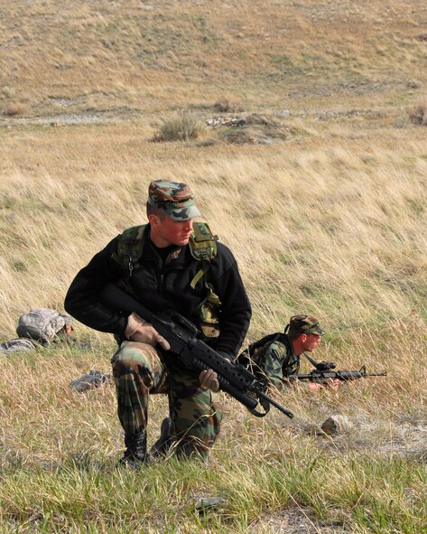 Members of the 185th Air Refueling Wing, Security Forces, from Sioux City, Iowa train on critical tasks of patrolling and small unit movements at Fort Harrison, Montana on 13 May 2009.  The training for patrols takes place in the three stages of classroom instruction, rehearsal, and a field exercise that incorporates land navigation skills. (US Air Force photo by TSgt Brian Cox)