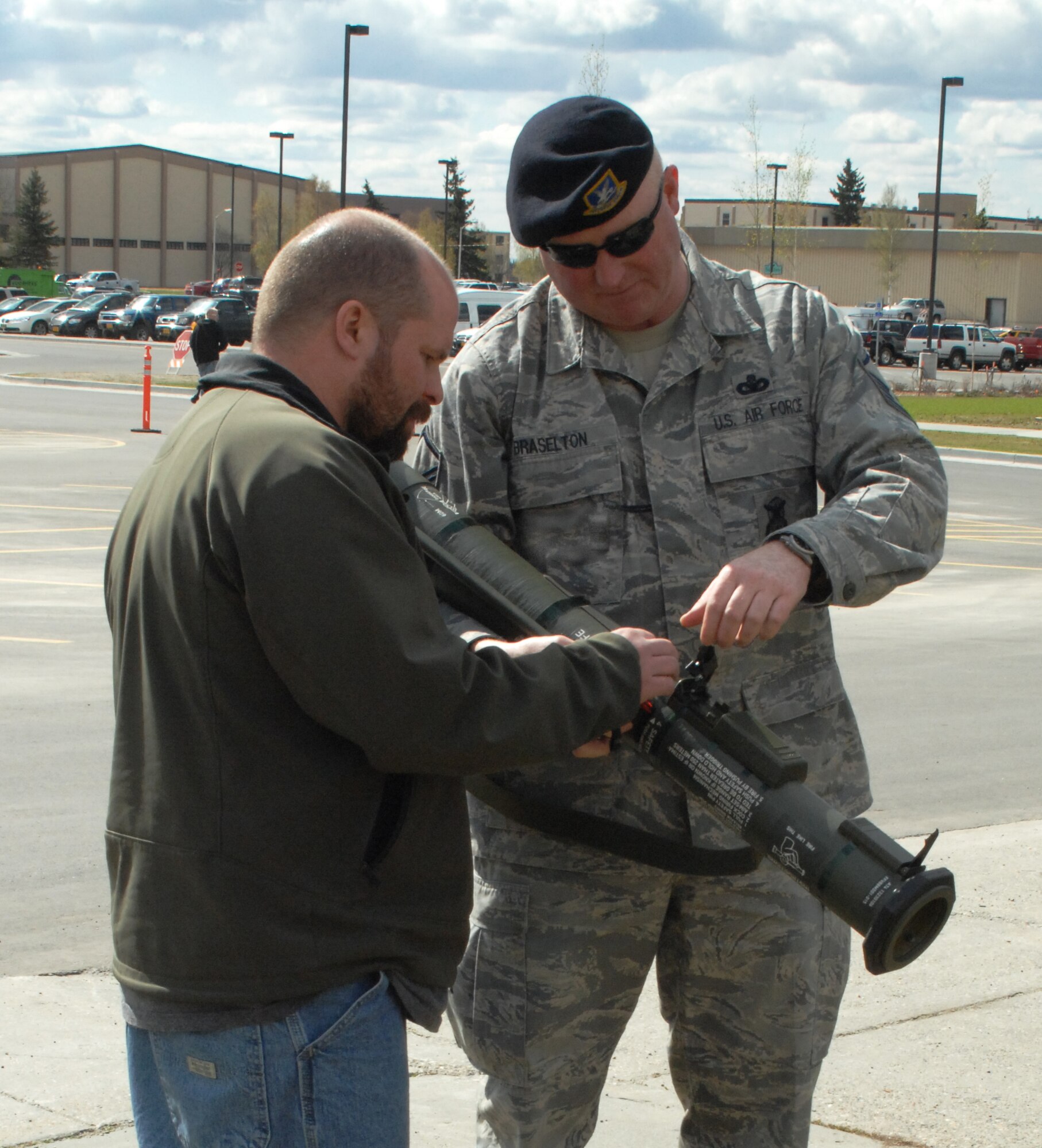 Master Sgt. Byron Braselton explains the capabilities of an M136 May 15, 2009, Eielson Air Force Base, Alaska. The 354th Security Forces Squadron concluded Police Week with a vehicle and weapons display and free cook out for the Eielson community. Sergeant Braselton is a Combat Arms Training instructor assigned to the 354th SFS.