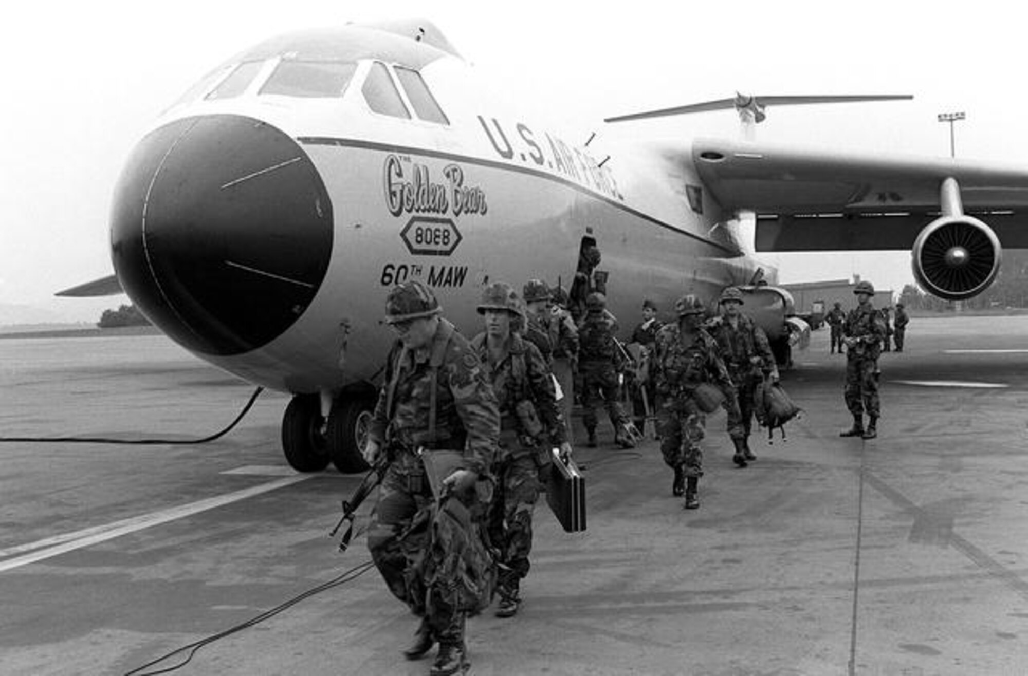 Troops disembark the Golden Bear in this undated photo. Though the last operational C-141 would depart Travis on Dec. 16, 1997, the Golden Bear would stay on at the base as a testament of everlasting endurance. On Sept. 16, 2005, the Golden Bear was dedicated as an aircraft display by the men and women of Travis. (U.S. Air Force photo)