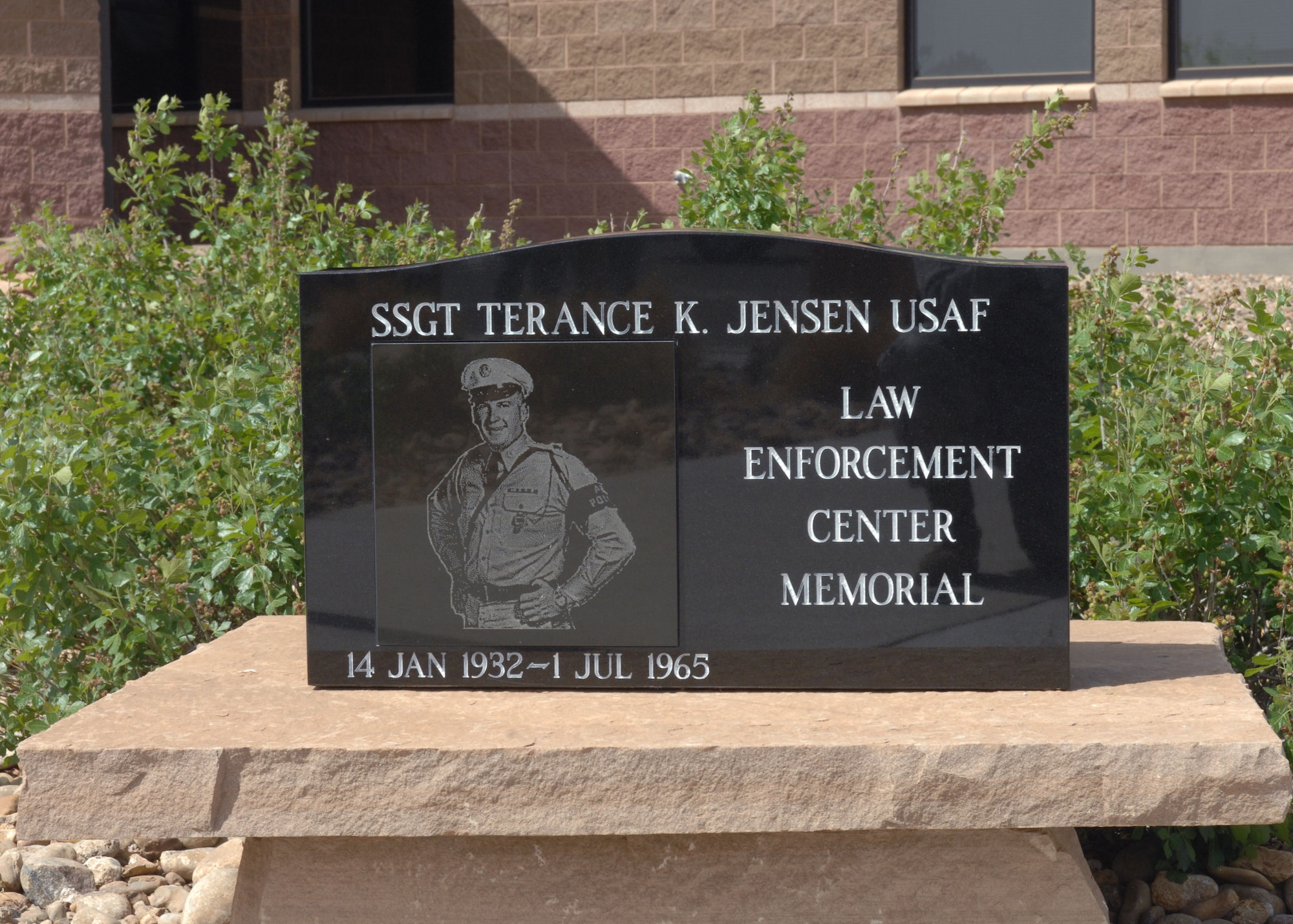 CANNON AIR FORCE BASE, N.M. -- A monument is revealed in front of the 27th Special Operations Security Forces Squadron building May 15.  The monument honored Staff Sgt. Terance Jensen, of the 35th Air Police Squadron at Da Nang Air Base, Republic of Vietnam, as part of national police week events.  Sergeant Jensen was the only fatality in the second major attack on a U.S. air base July 1, 1965.  (U.S. Air Force photo/Airman 1st Class James Bell) 
