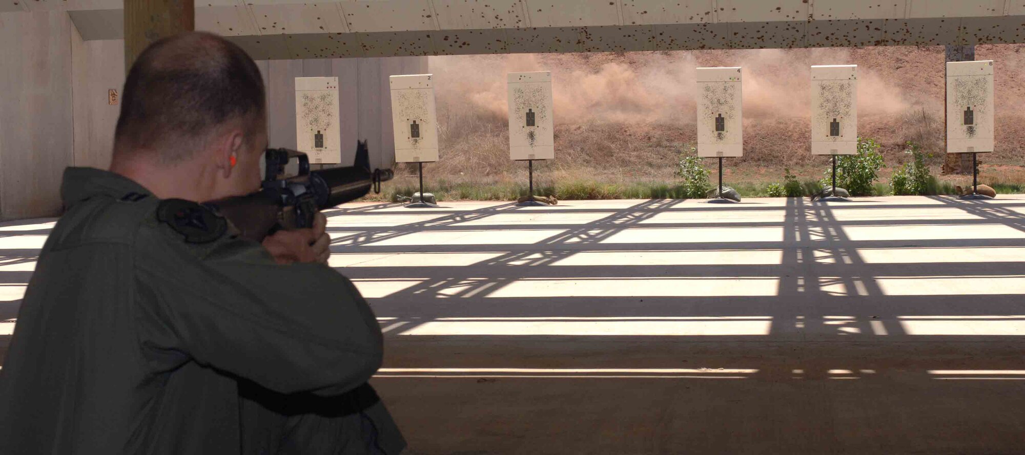 CANNON AIR FORCE BASE, N.M. -- Capt. Joel Bloomquist, of the 3rd Special Operations Squadron, shoots a target at the Combat Arms firing range May 12.  Captain Bloomquist earned a bronze excellence in competition medal with a score of 463.  (U.S. Air Force photo/Airman 1st Class James Bell) 