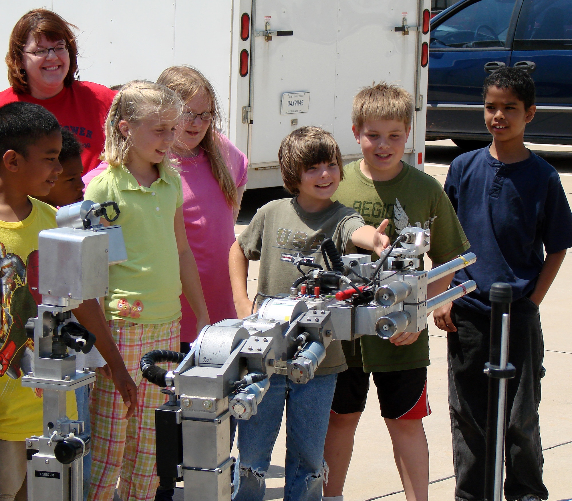 Students from Eisenhower Elementary School meet the Oklahoma Highway Patrol’s Remotec ANDROS F6A bomb robot during a demonstration on base May 15. The OHP and Vance’s 71st Security Forces Squadron teamed up for a Cops-for-Kids event as part of National Police Week. (U.S. Air Force photo/Joe B. Wiles)