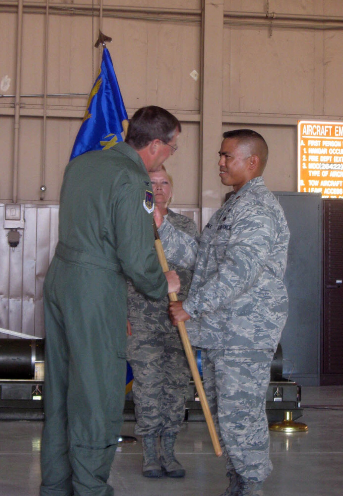 Maj. Michael Egbalic (right), accepts the 926th Aircraft Maintenance Squadron guideon from Col. David Culbertson, 926th Group commander, as he takes command of the newly-activated U.S. Air Force Reserve squadron May 15. Through the Air Force's Total Force Integration initiative, the squadron's members work on F-15, F-16 and F-22 aircraft within Regular Air Force units.