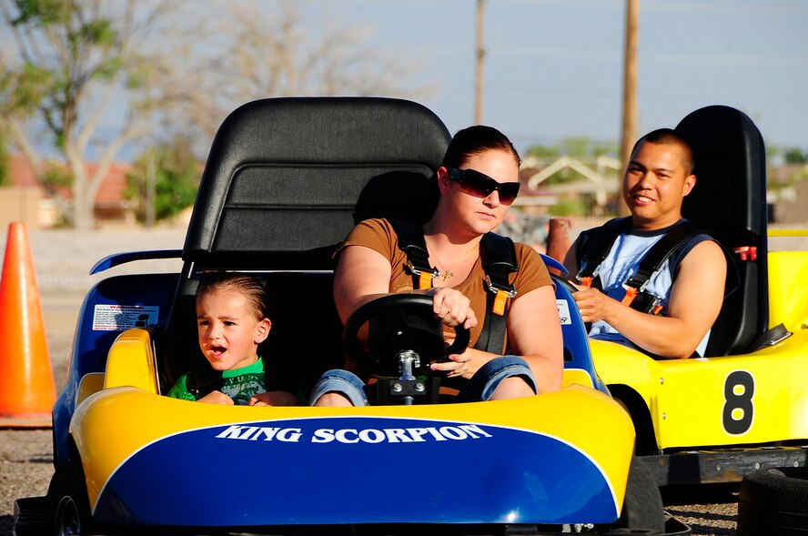 Members from Holloman Air Force Base, N.M., and their families enjoy the go-karts at the Summer Block Party, May 15. The go-karts were one portion of the Block Party. There was also paintball, cosmic bowling and batting cages. (U.S. Air Force photo/ Technical Sgt. Chris Flahive)