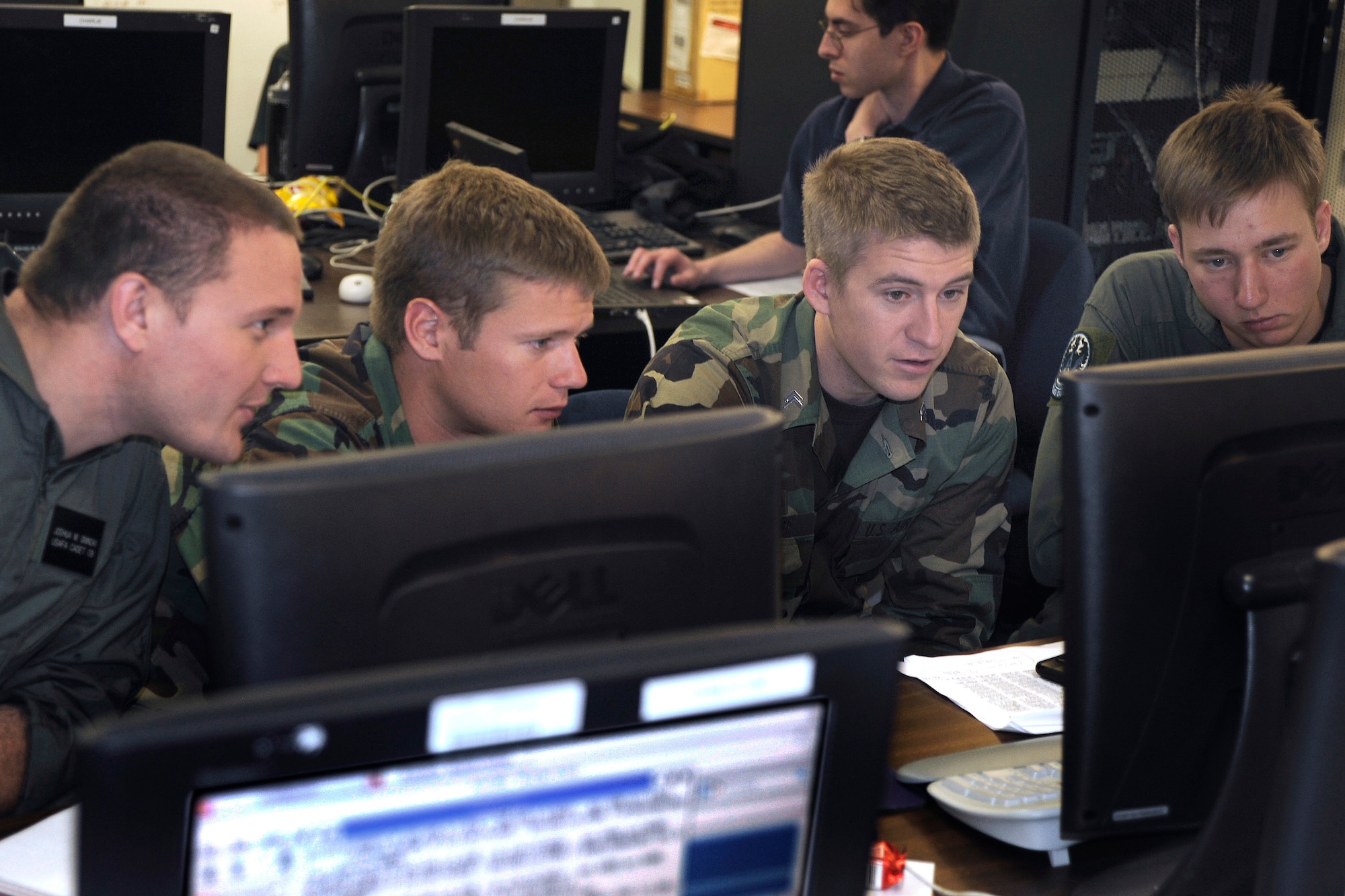 Cadets successfully defend a computer network against simulated intrusions during a Cyber-Defense Exercise April 24. The cyber exercise is a computer security competition designed to educate cadets about the role of information assurance in protecting critical information systems. (U.S. Air Force photo)
