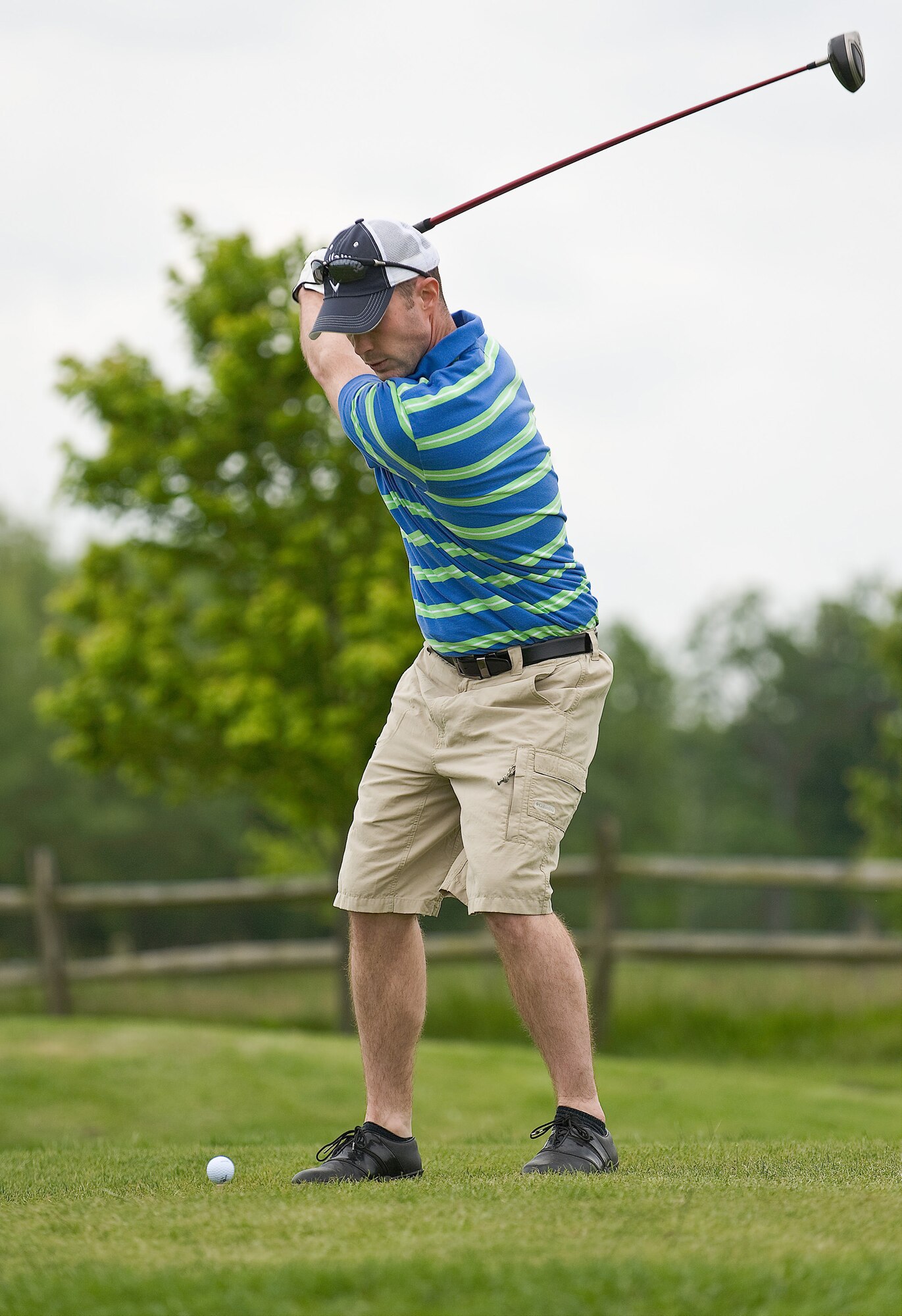 Senior Airman Jacob Schlemmer, 436th Aircraft Maintenance Squadron, tees off during the Bluesuiters Golf Tournament May 14. The golf tournament paired local civic leaders with base personnel to strengthen community relations. (U.S. Air Force photo/Roland Balik)