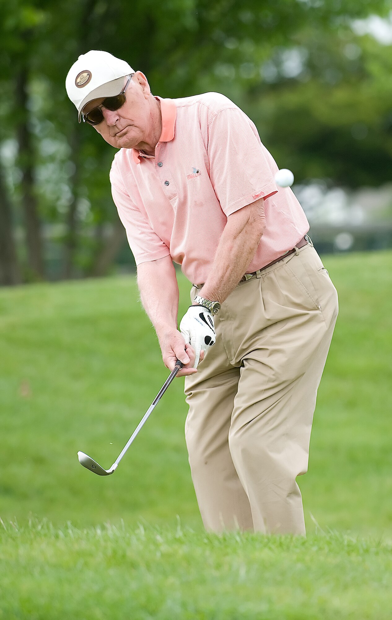 George Chabbott chips on to the green during the annual Bluesuiter's golf tournament May 14. Local business and civic leaders spent a day on the golf course with Airmen from Dover Air Force Base to strengthen ties between the community and the base. (U.S. Air Force Photo/Jason Minto)