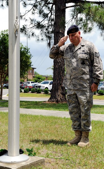 MOODY AIR FORCE BASE, Ga. -- Tech. Sgt. Edwin Lipp, 23rd Security Forces Squadron operations, renders a salute to honor fallen police officers during a National Police Week ceremony here May. 15. On Oct. 1, 1962, the president proclaimed May 15 as Peace Officers Memorial Day and the week surrounding it as National Police Week. (U.S. Air Force photo by Airman 1st Class Joshua Green) 
