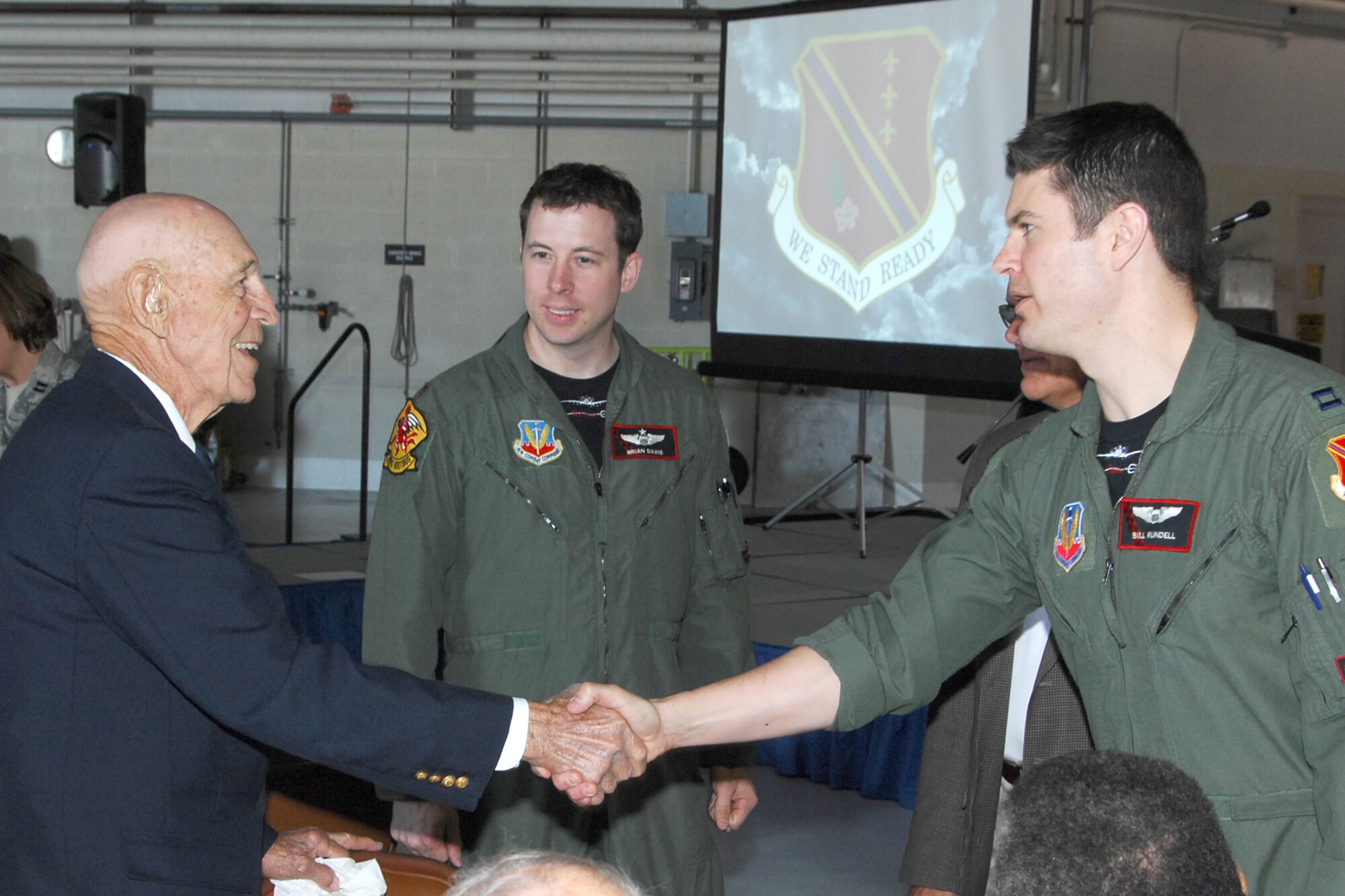 Lt. Col. Richard Cole, USAF (ret.), co-pilot for Lt. Col. Jimmy Doolittle during the Doolittle Raid on Japan spent time meeting 107th Fighter Squadron pilots Capt. William Rundell and Major Brian Davis during the May 19 Base Community Council luncheon where Cole and Doolittle Raider historian Col. Carroll Glines, USAF (ret.), were guest speakers. (USAF photo by John S. Swanson)