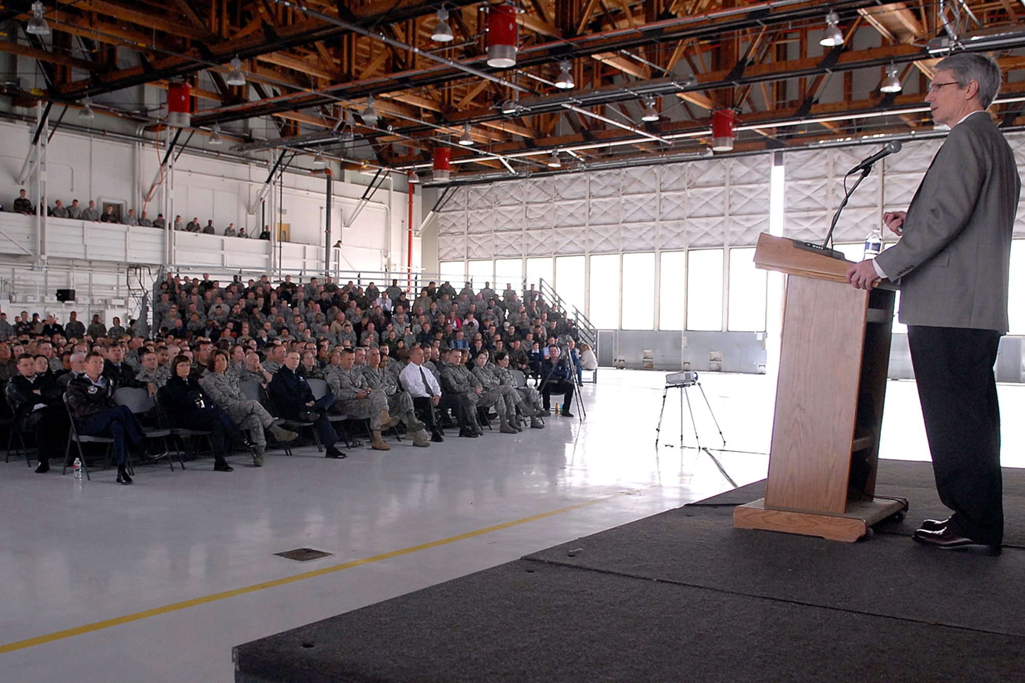 Dr. Scott Stanley, research professor and co-director of the Center for Marital and Family Studies at the University of Denver, addressed the audience during the Building Healthy Relationships Focus Day presentation in Hanger 140 May 11. The presentation provided attendees with the skills to manage and develop professional and personal relationships, along with tools to combat stress. (U.S. Air Force photo by Rob Bussard)