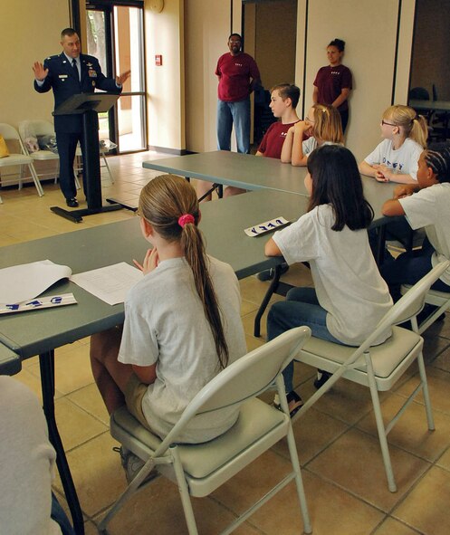 LAUGHLIN AIR FORCE BASE, Texas -- Col. David Ellis, 47th Flying Training Wing vice commander, speaks to a group of children during their graduation from the Drug Education For Youth program here May 16. DEFY is a year-long program for Laughlin children and teenagers that gives them the tools to resist drugs, gangs and alcohol. (U.S. Air Force photo by Airman 1st Class Sara Csurilla)