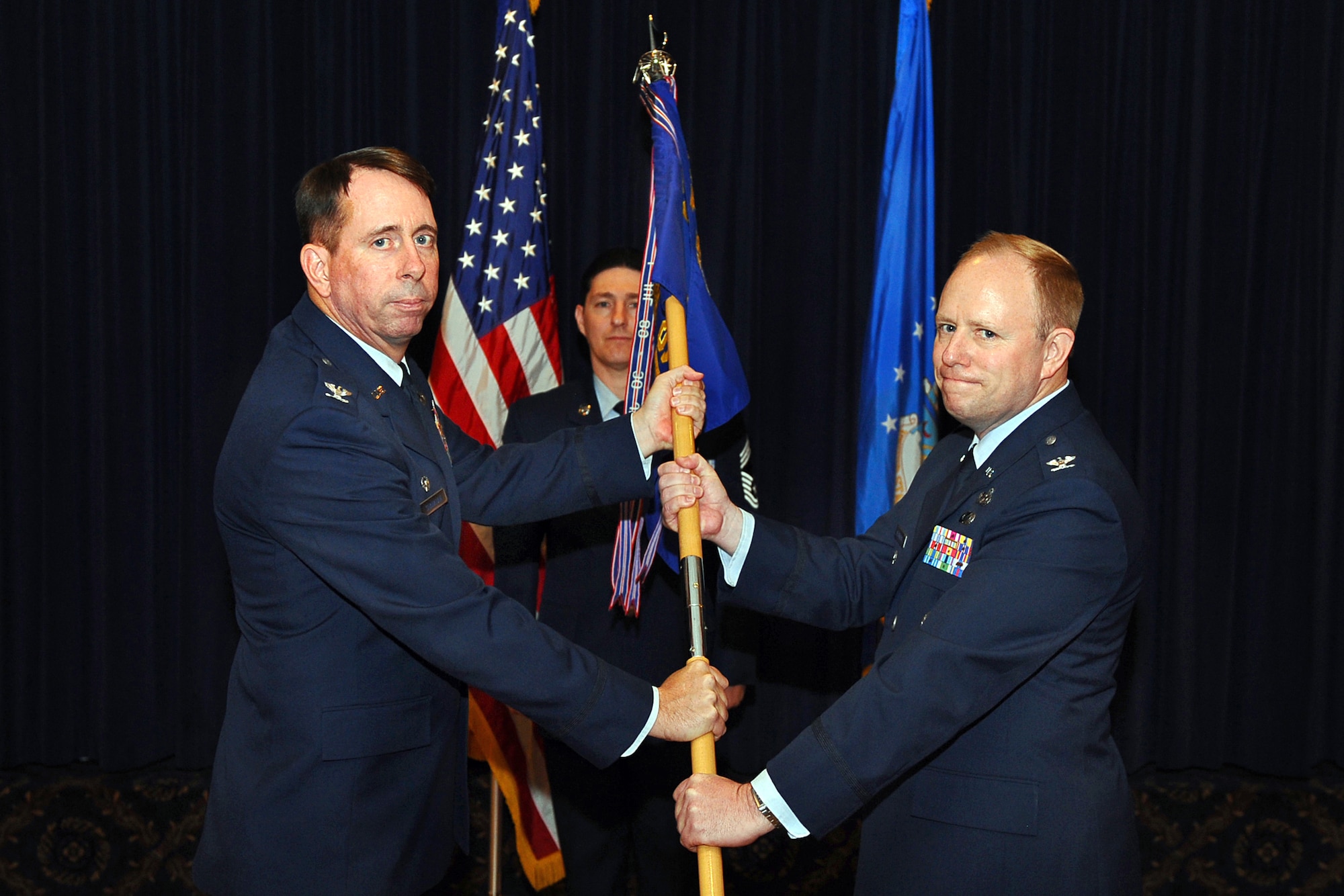 OFFUTT AIR FORCE BASE, Neb. - Col. John N.T. Shanahan, 55th Wing commander  gives the 55th Mission Support Group guidon to Col. Michael J. Allshouse as he accepts the role as the new 55th MSG commander, in a change of command ceremony held at the Patriot Club, May 19. Colonel Allshouse replaces Col. Thomas W. Goffus who moves to his new assignment at the U.S. State Department. 

U.S. Air Force photo by Josh Plueger

