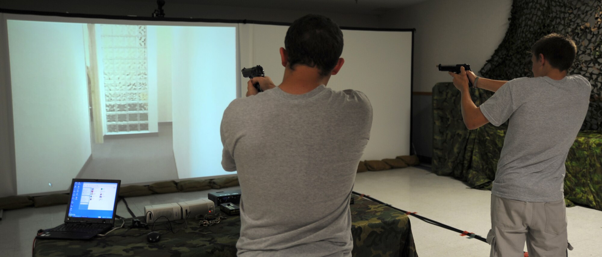 MCCONNELL AIR FORCE BASE, Kan. -- Students from Crooked Oak High School participate in the fire arms training simulator run by the 22nd Security Forces Squadron, May 14. The FATS helps Air Force members in determining what to do in the event they might encounter hostile fire or life-threatening situations. (Photo by Senior Airman Laura Suttles)