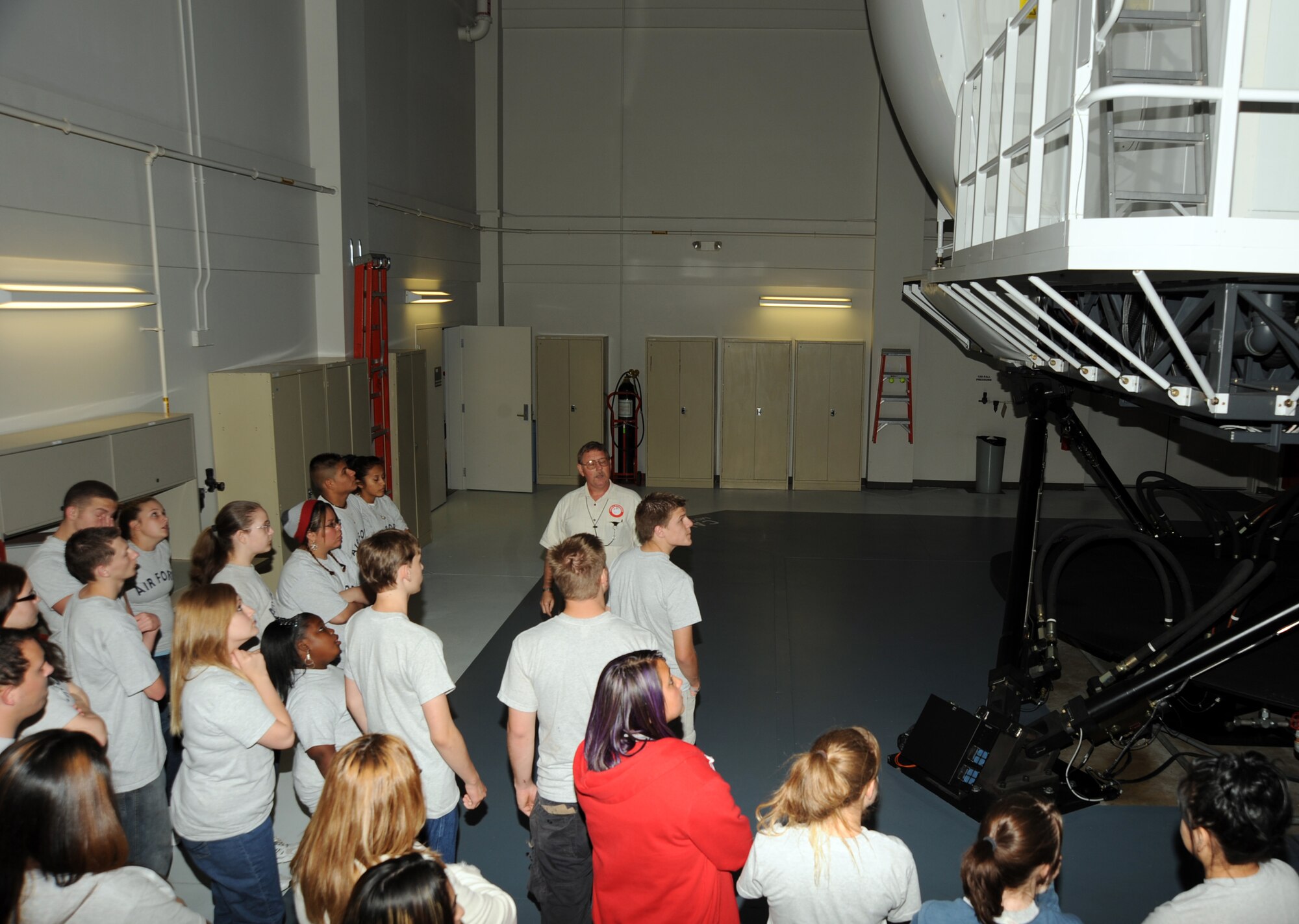 MCCONNELL AIR FORCE BASE, Kan. -- Junior Reserve Officer Training Corps cadets from Crooked Oak High School are briefed by John Dock from the flight simulator office during a base tour, May 14. The students toured the base in an effort to better understand McConnell’s refueling mission and gain further knowledge about the Air Force way of life. (Photo by Senior Airman Laura Suttles)