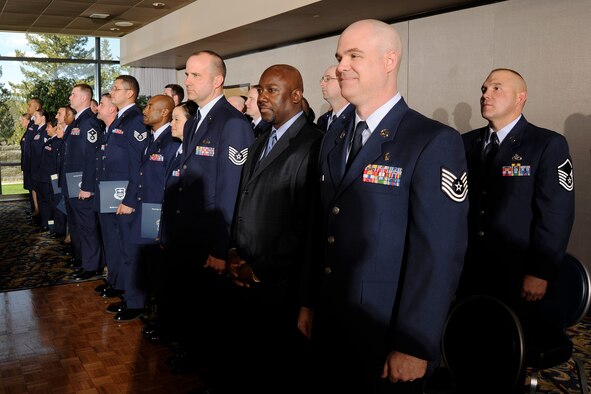 Community College of the Air Force graduates receive their degrees during a ceremony at the U.S. Air Force Academy's Falcon Club May 7. Many of the 84 graduates worked on obtaining their CCAF degrees during or between deployments. (U.S. Air Force photo/Mike Kaplan)