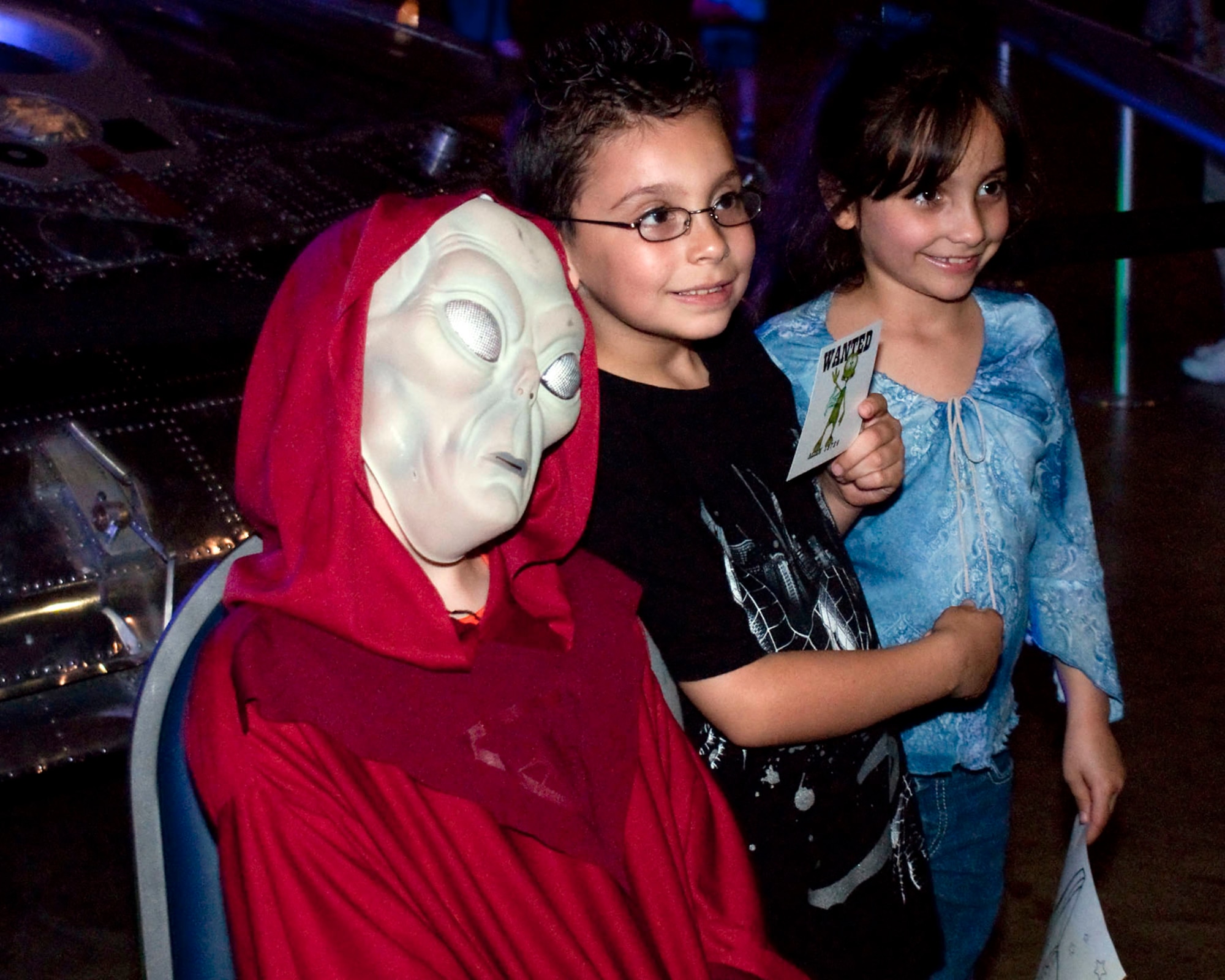 Visitors pose with an alien during Night at the Air Force Museum May 15 at the National Museum of the U.S. Air Force in Dayton, Ohio. (U.S. Air Force photo/Dick Brice)