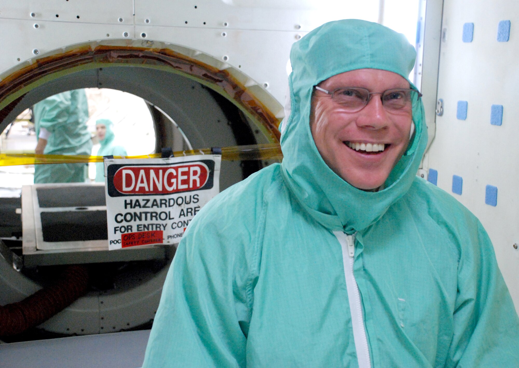 PATRICK AIR FORCE BASE, Fla. - Citizen Airman and modern-day pioneer Senior Master Sgt. Kevin Zimmerman gets ready to climb inside the Space Shuttle Atlantis wearing a sterile suit where he works as the mid-body electrical lead.  When he's not sending shuttles into space, he serves as an HC-130P/N Combat Radio Operator with the 920th Rescue Wing here.  The shuttle Atlantis is set to return to Earth May 23 after mission specialists completed the fifth and final mission to service the Hubble Space Telescope. Throughout his 23-career with United Space Alliance (USA), NASA's lead contractor, he has supported a long list of notable space missions, to include Atlantis's Maiden Voyage. (U.S. Air Force Photo/Capt Cathleen Snow)