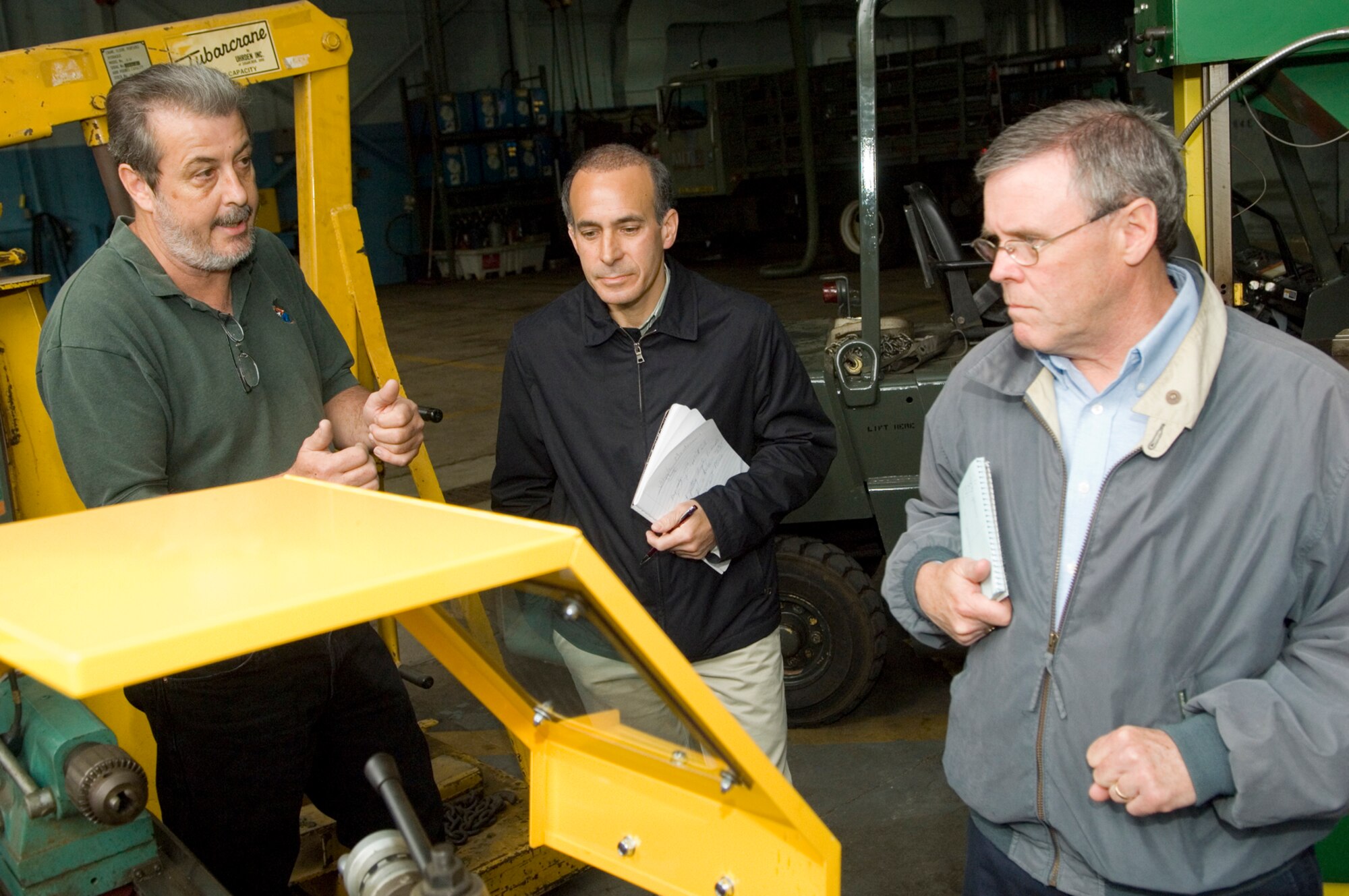 HANSCOM AIR FORCE BASE, Mass. –John Sharpe (left), 66th Logistics Readiness Squadron, unit safety representative, reviews machine guarding procedures with Occupational Safety and Health Administration Voluntary Protection Program auditors, Dan Montanaro (center), and Bob Sands (right) during Hanscom’s Voluntary Protection Program audit May 18.  Hanscom is undergoing an audit by OSHA of its Voluntary Protection Program to determine if the base has met the requirements to become the first Air Force installation to earn VPP certification. (U.S. Air Force photo by Mark Wyatt) 
